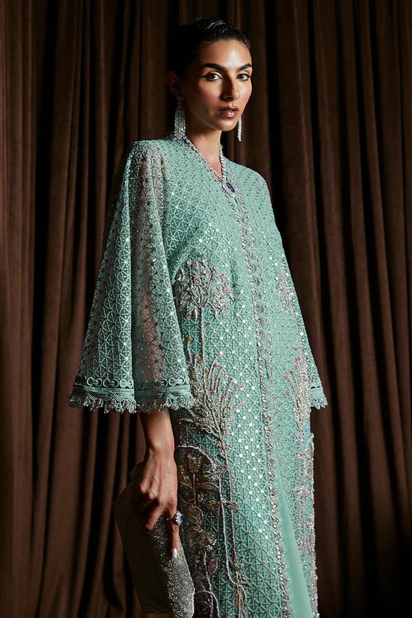 Model wearing Suffuse Luxury Pret '24 LIVIA Aqua Front Open Kaftan. Pakistani clothes online in UK.