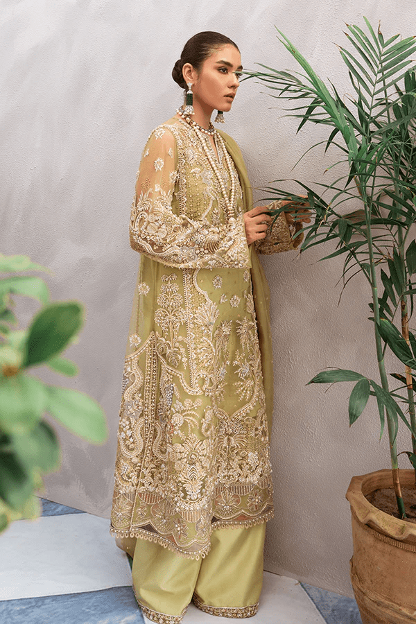 Model wearing Suffuse Sage dress, a luxurious choice from Luxury Pret Aura collection. Perfect for Pakistani wedding clothes online in UK.