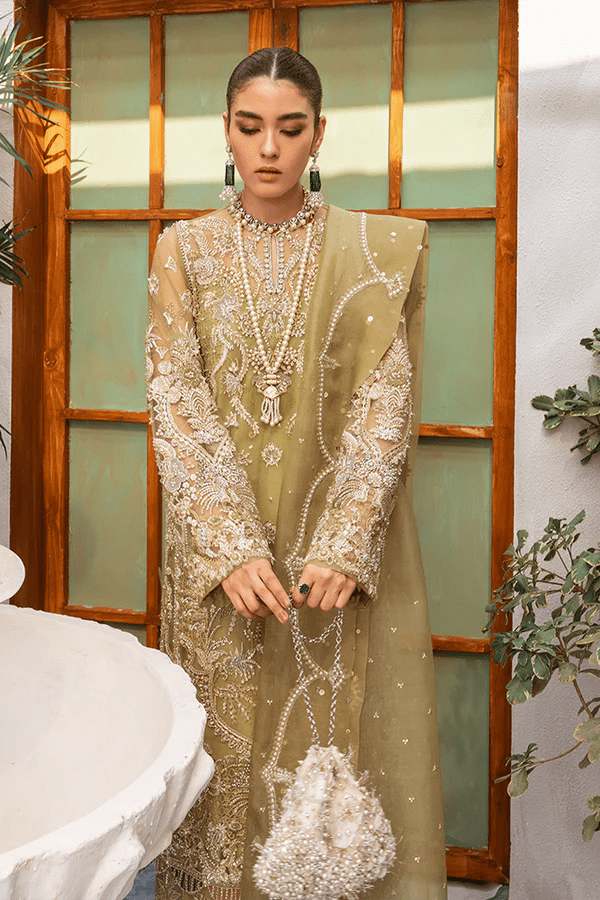 Model wearing Suffuse Sage dress, a luxurious choice from Luxury Pret Aura collection. Perfect for Pakistani wedding clothes online in UK.