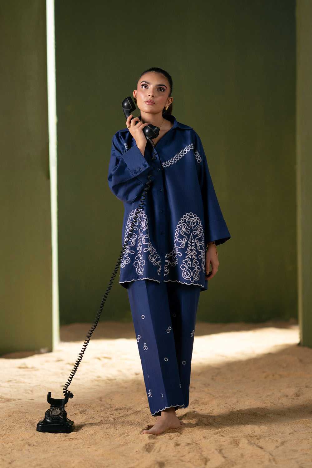 Model wearing navy blue embroidered outfit from Saira Rizwan Joolie | BLUE-JBP25-03, Pakistani luxury pret available online in UK.