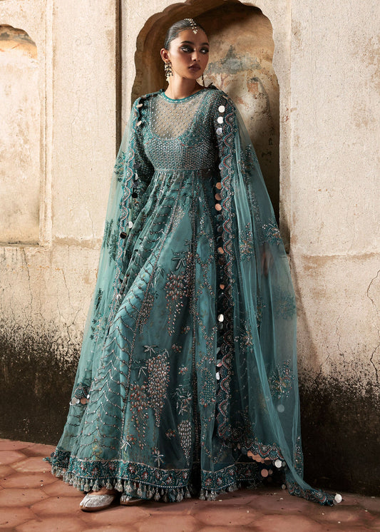 Model wearing Nagma by Hussain Rehar in teal blue with heavy embellishments – Pakistani luxury pret, shop Hussain Rehar online in UK.
