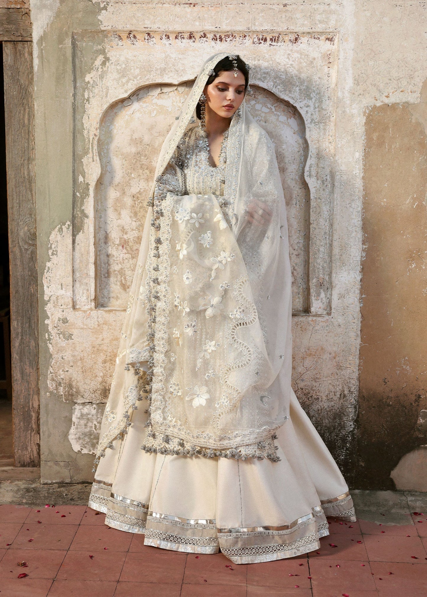 Model wearing Sitara by Hussain Rehar in ivory with silver mirror work – Pakistani luxury pret, shop Hussain Rehar clothes online in UK.

