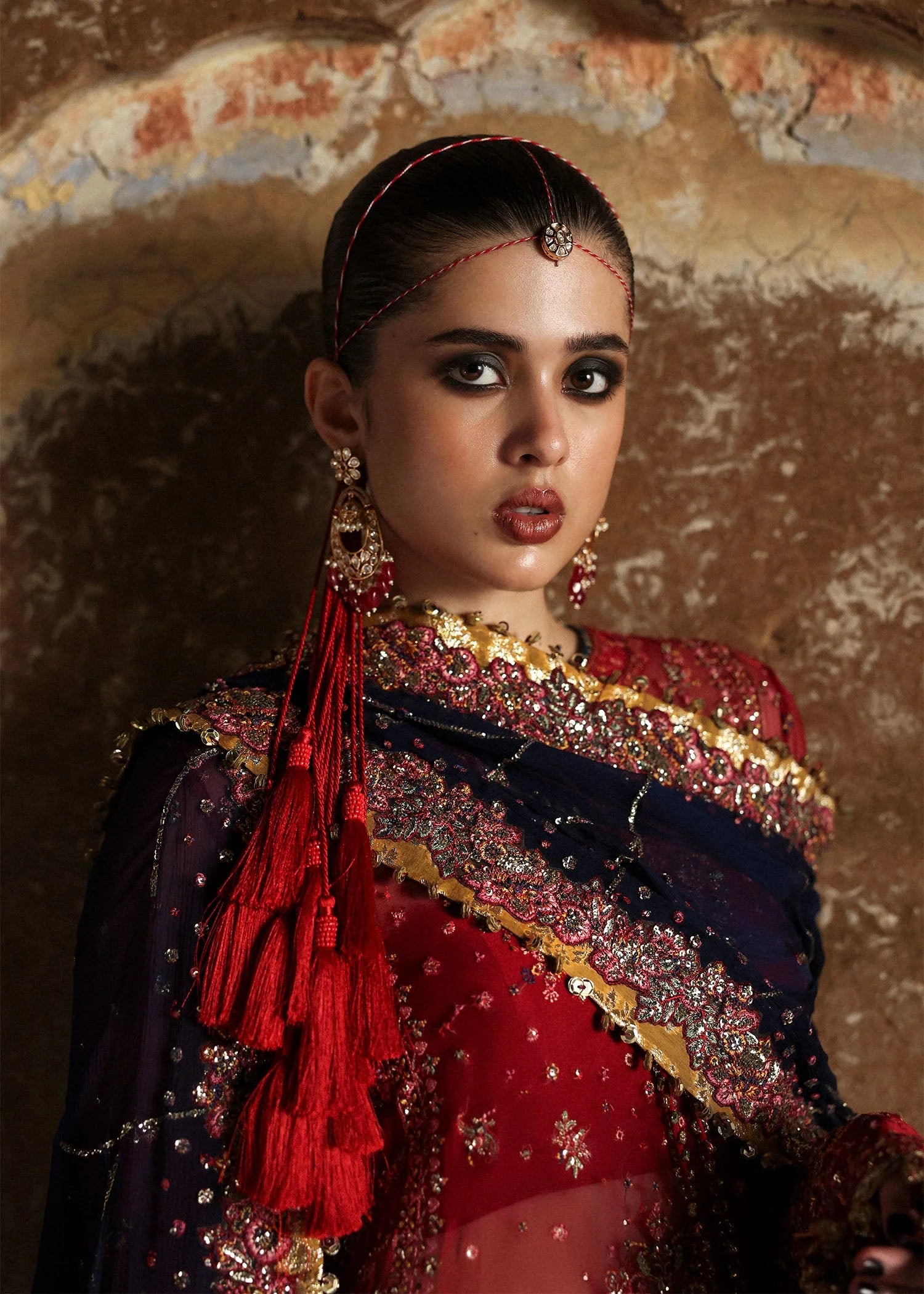 Model wearing Shahrbano by Hussain Rehar in deep red with navy dupatta – Pakistani luxury pret, shop Hussain Rehar clothes online in UK.
