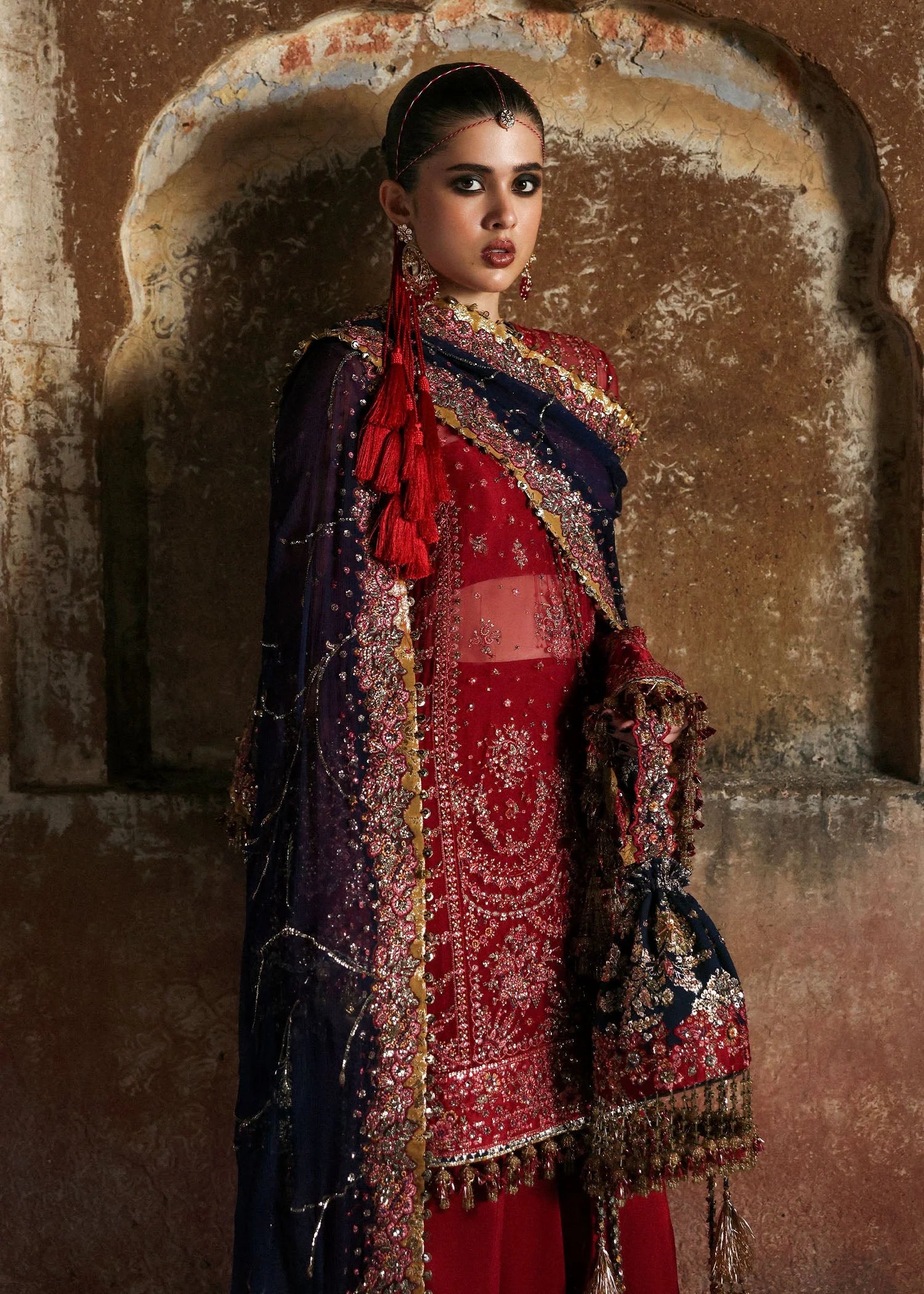 Model wearing Shahrbano by Hussain Rehar in deep red with navy dupatta – Pakistani luxury pret, shop Hussain Rehar clothes online in UK.
