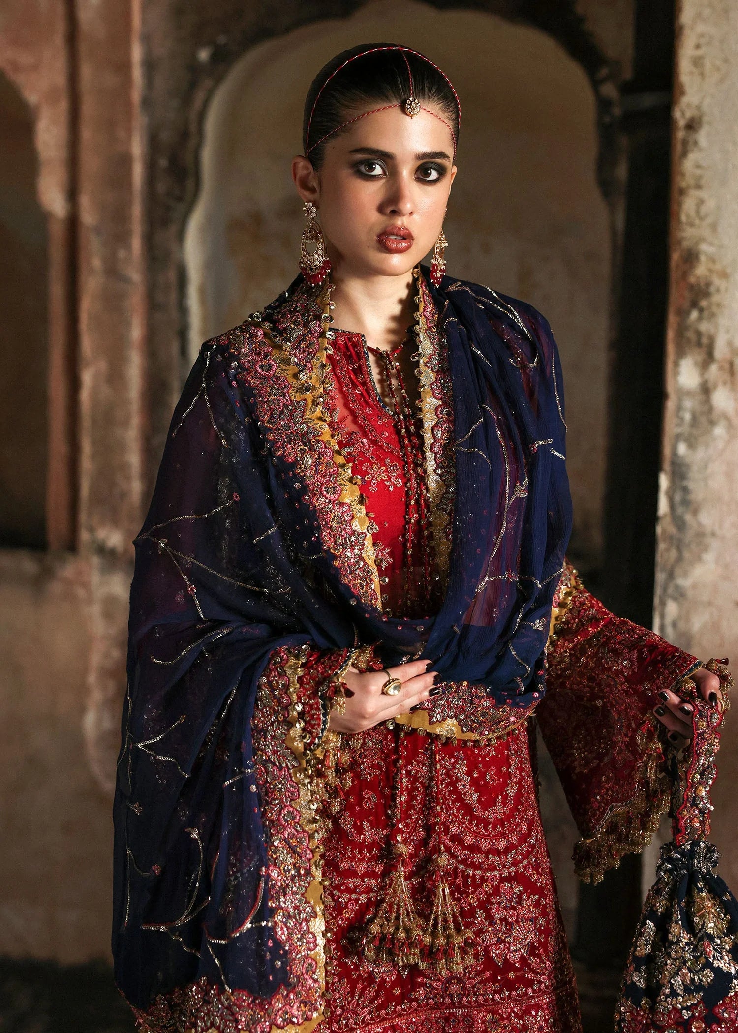 Model wearing Shahrbano by Hussain Rehar in deep red with navy dupatta – Pakistani luxury pret, shop Hussain Rehar clothes online in UK.

