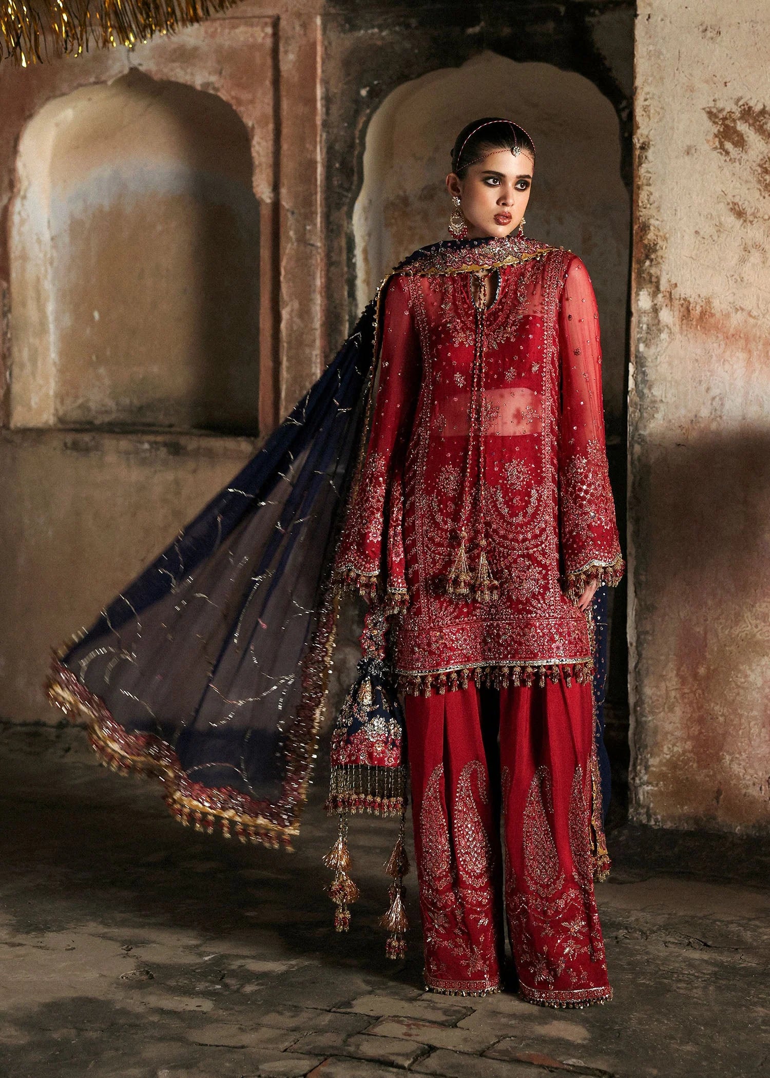 Model wearing Shahrbano by Hussain Rehar in deep red with navy dupatta – Pakistani luxury pret, shop Hussain Rehar clothes online in UK.

