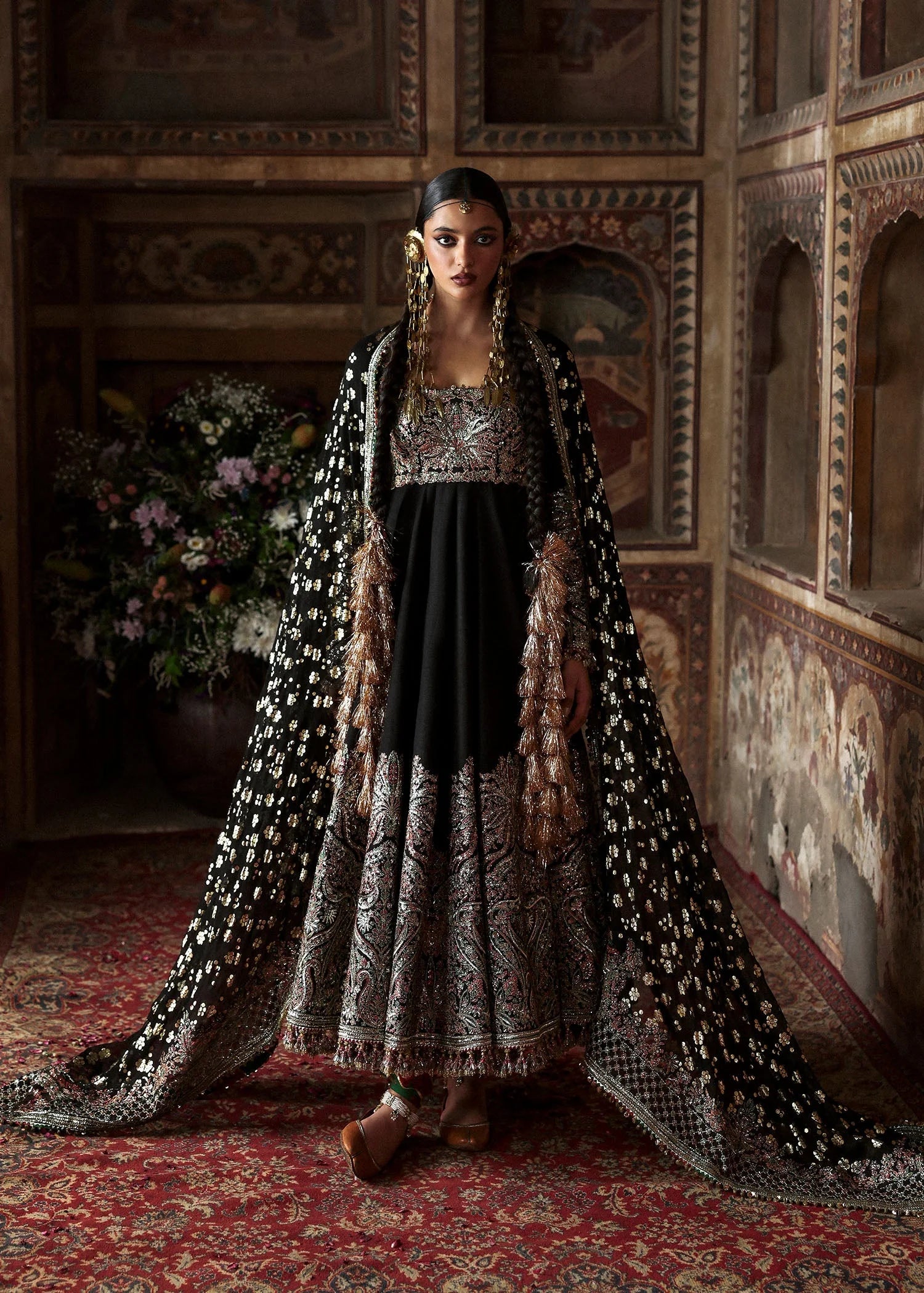 Model wearing Noor Jehan by Hussain Rehar in black with intricate embroidery – Pakistani luxury pret, shop Hussain Rehar online in UK.

