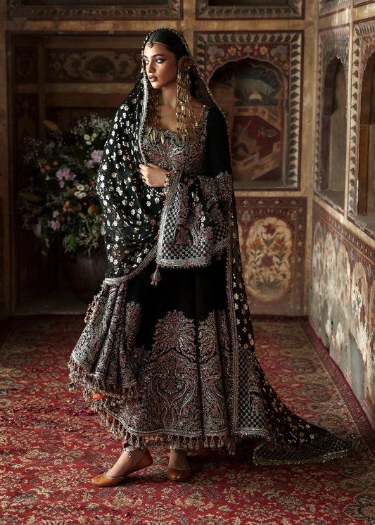 Model wearing Noor Jehan by Hussain Rehar in black with intricate embroidery – Pakistani luxury pret, shop Hussain Rehar online in UK.
