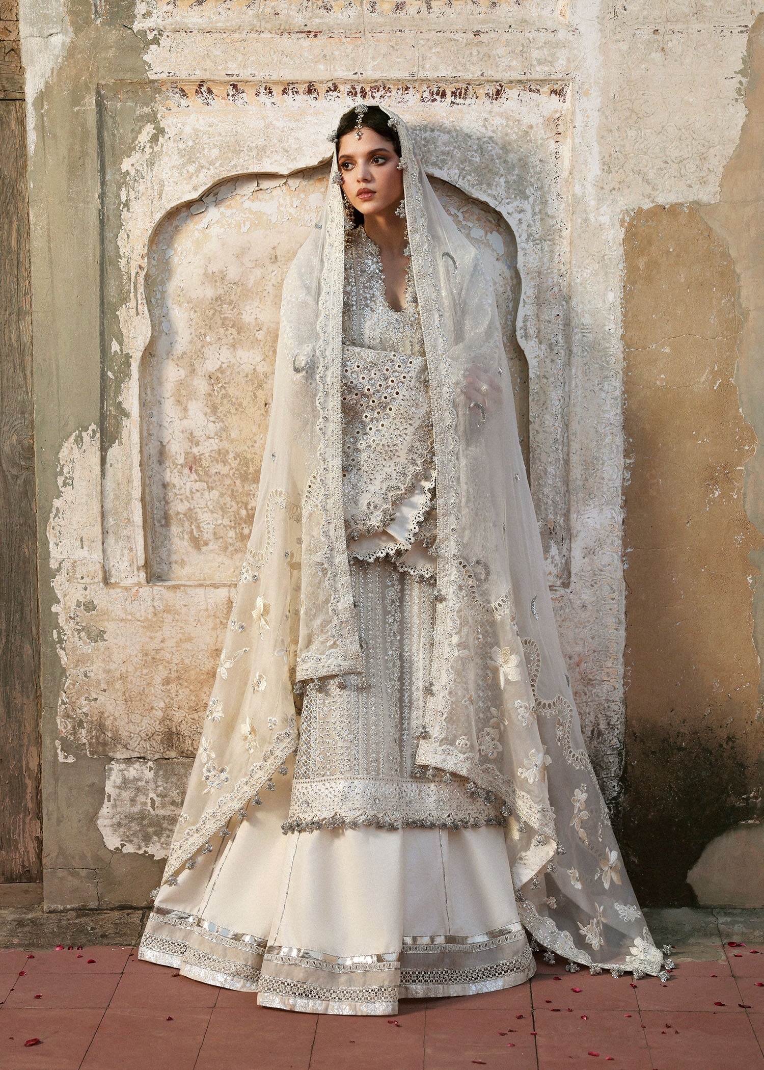 Model wearing Sitara by Hussain Rehar in ivory with silver mirror work – Pakistani luxury pret, shop Hussain Rehar clothes online in UK.
