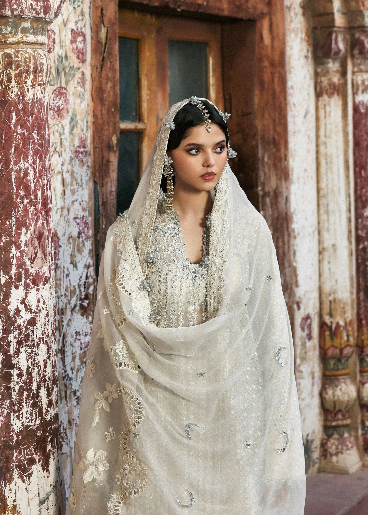 Model wearing Sitara by Hussain Rehar in ivory with silver mirror work – Pakistani luxury pret, shop Hussain Rehar clothes online in UK.
