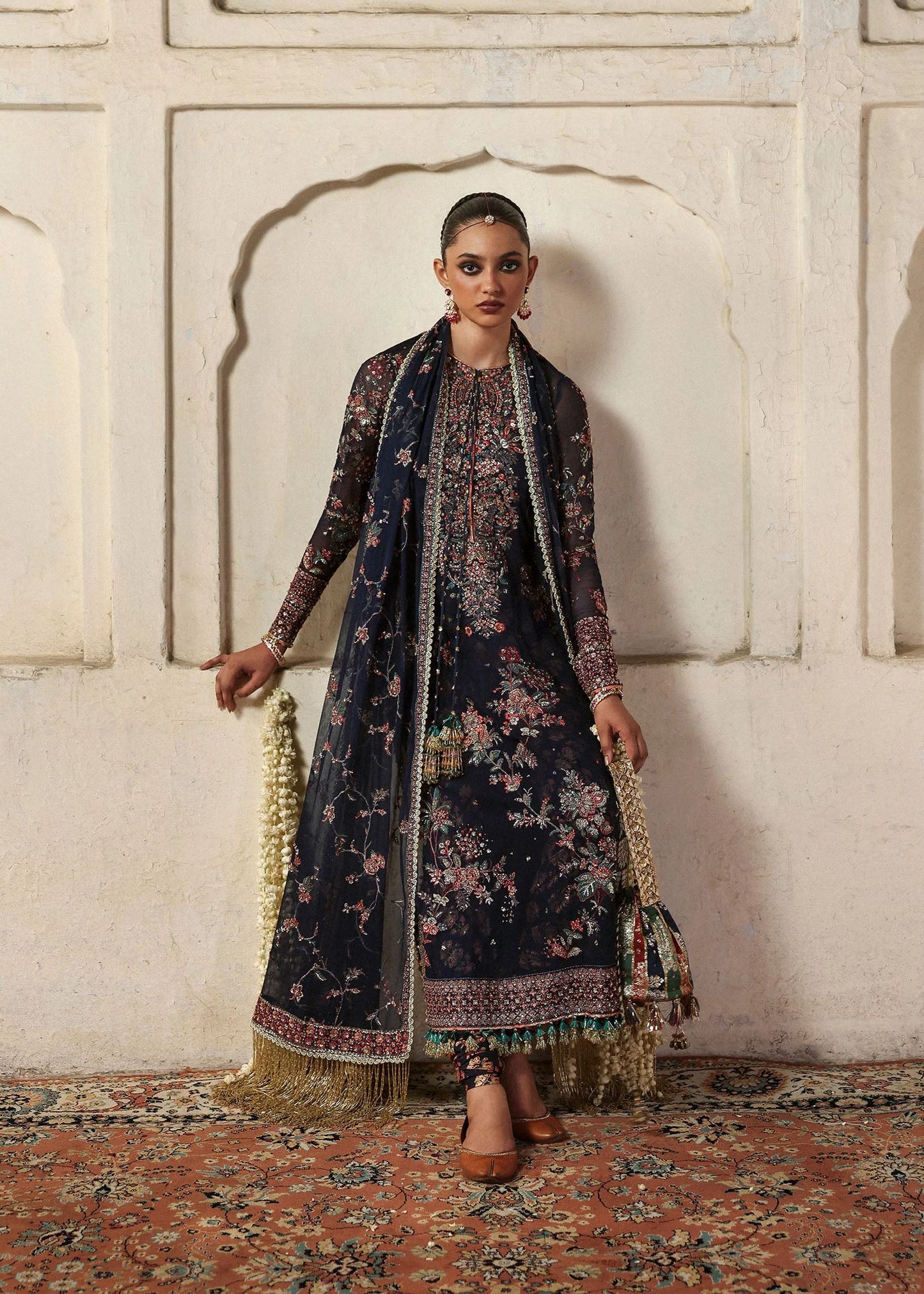 Model wearing Rabab by Hussain Rehar in navy blue floral – Pakistani luxury pret, shop Hussain Rehar clothes online in UK for festive wear.
