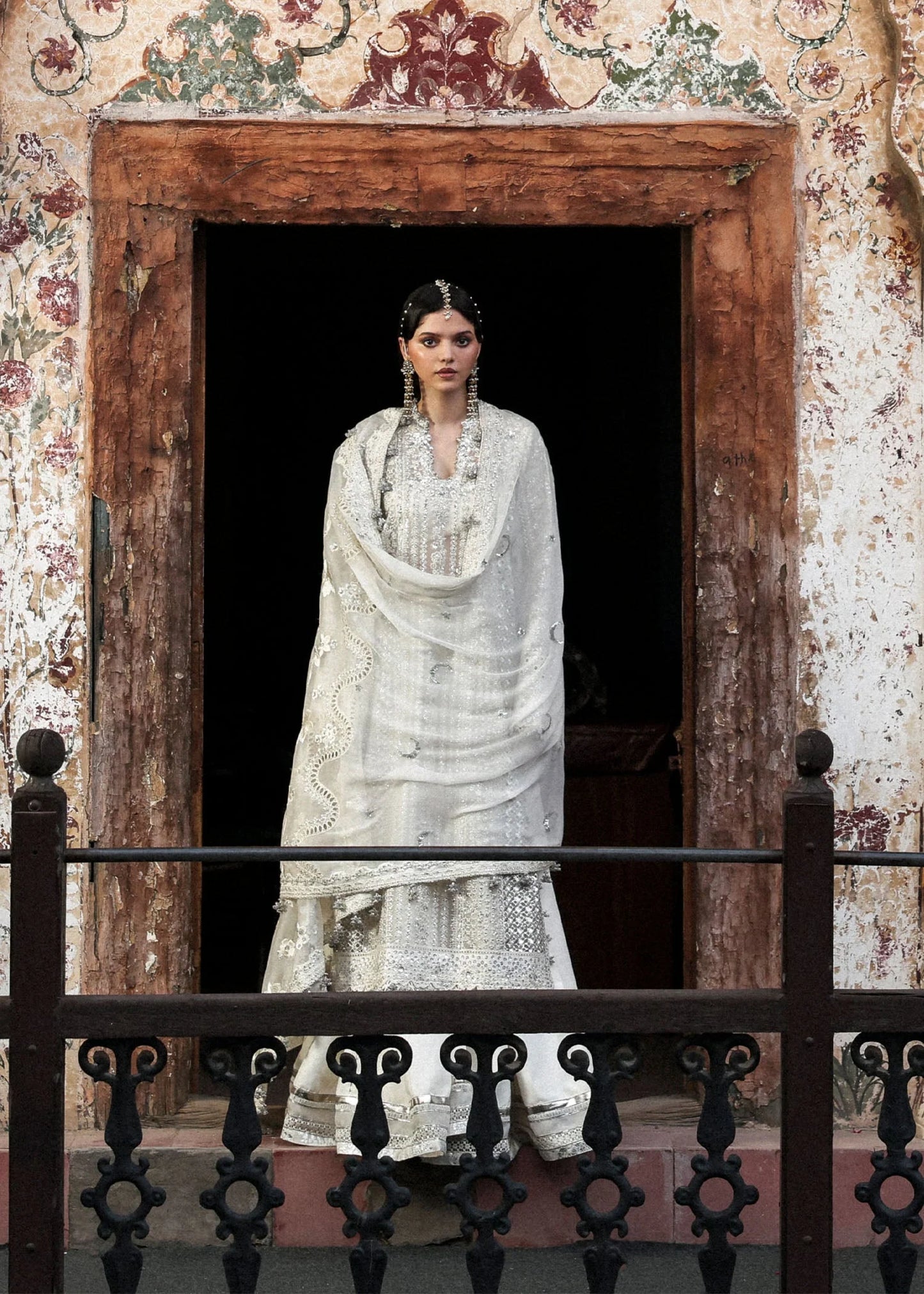 Model wearing Sitara by Hussain Rehar in ivory with silver mirror work – Pakistani luxury pret, shop Hussain Rehar clothes online in UK.
