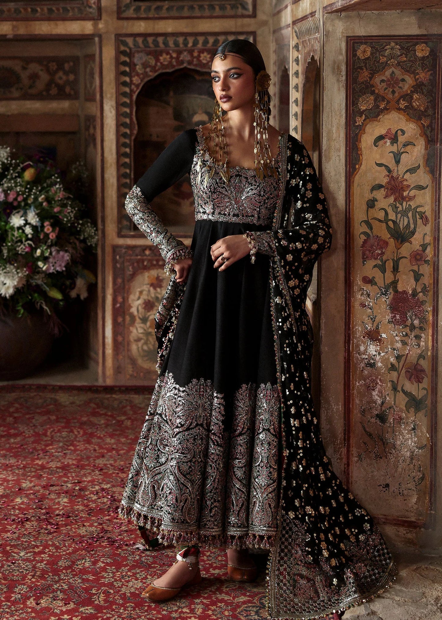 Model wearing Noor Jehan by Hussain Rehar in black with intricate embroidery – Pakistani luxury pret, shop Hussain Rehar online in UK.

