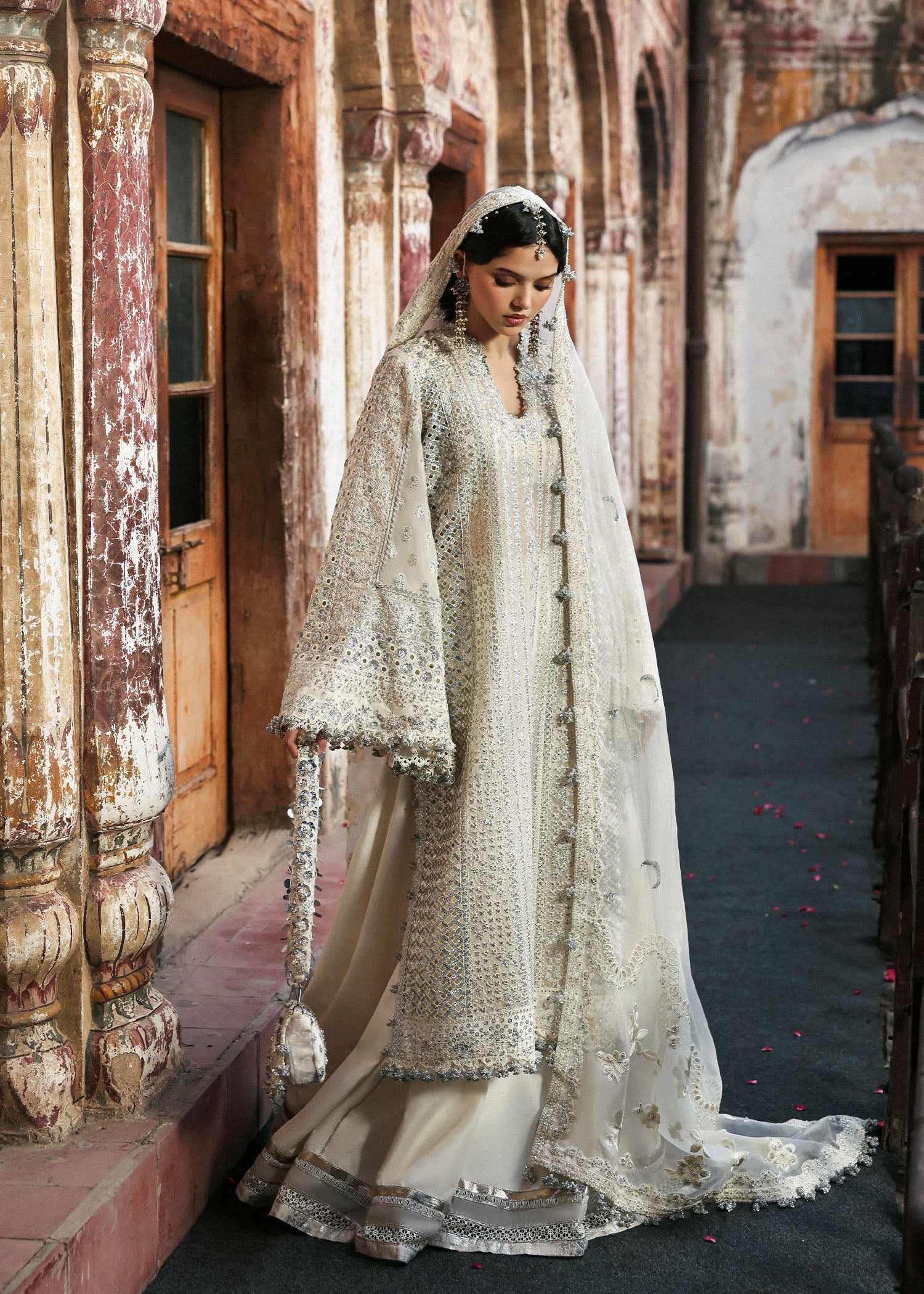 Model wearing Sitara by Hussain Rehar in ivory with silver mirror work – Pakistani luxury pret, shop Hussain Rehar clothes online in UK.
