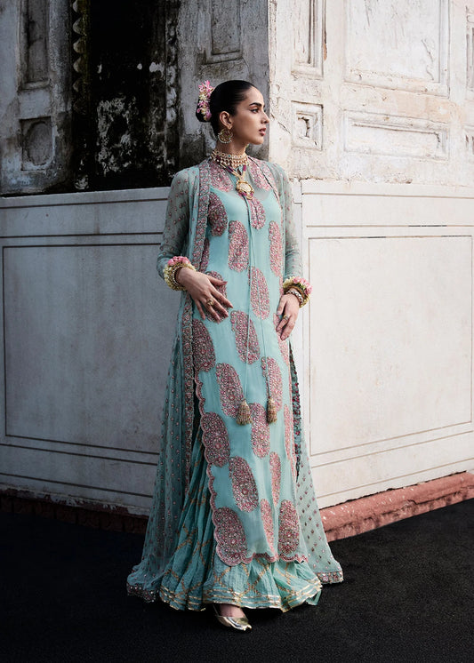 Model wearing Maklina by Hussain Rehar in Sky Blue embroidered ensemble – Pakistani luxury pret available online in UK.
