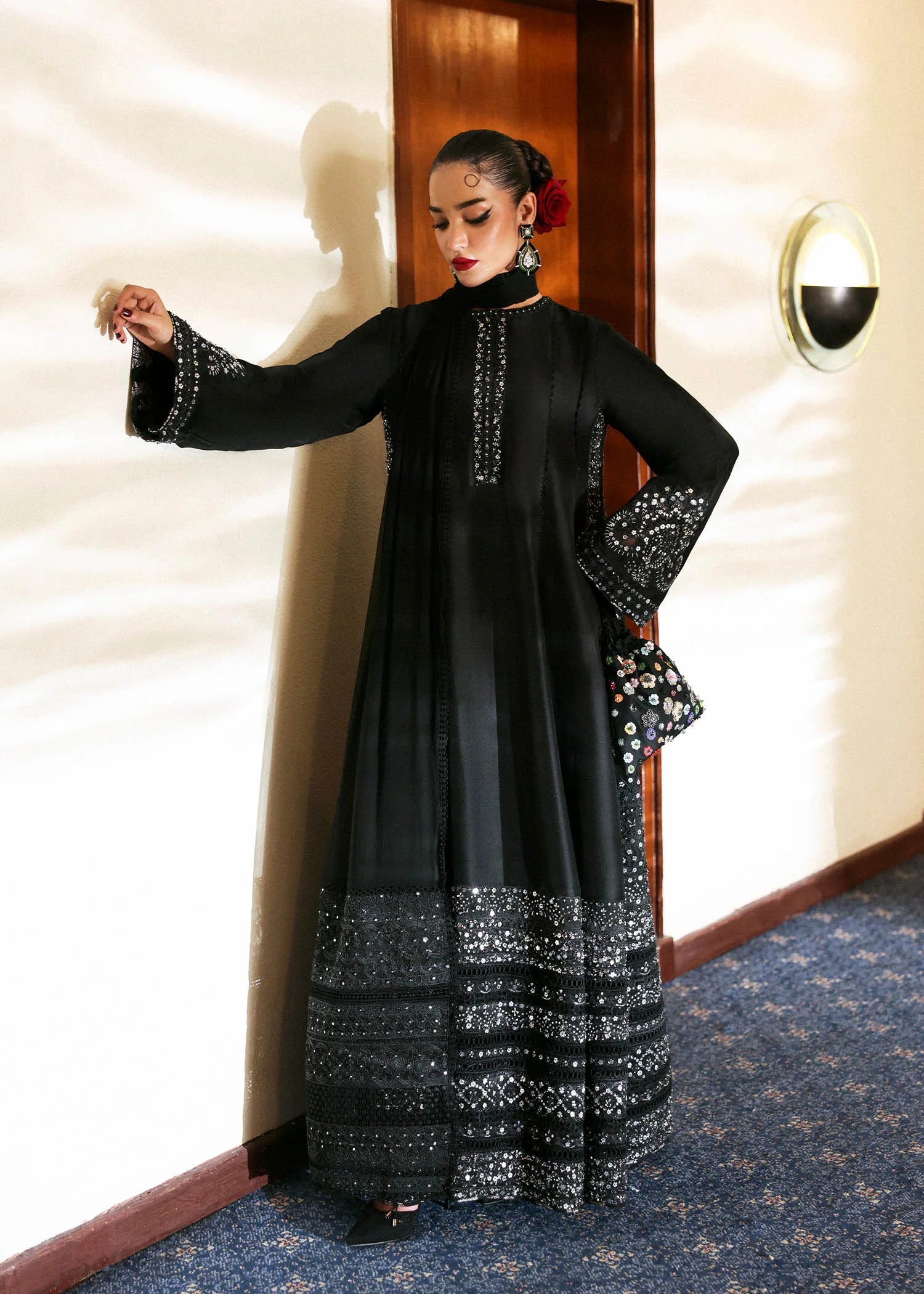 Model wearing black Noer dress by Hussain Rehar, Pakistani luxury pret available online in UK for festive celebrations.