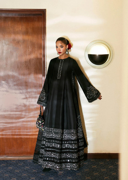 Model wearing black Noer dress by Hussain Rehar, Pakistani luxury pret available online in UK for festive celebrations.