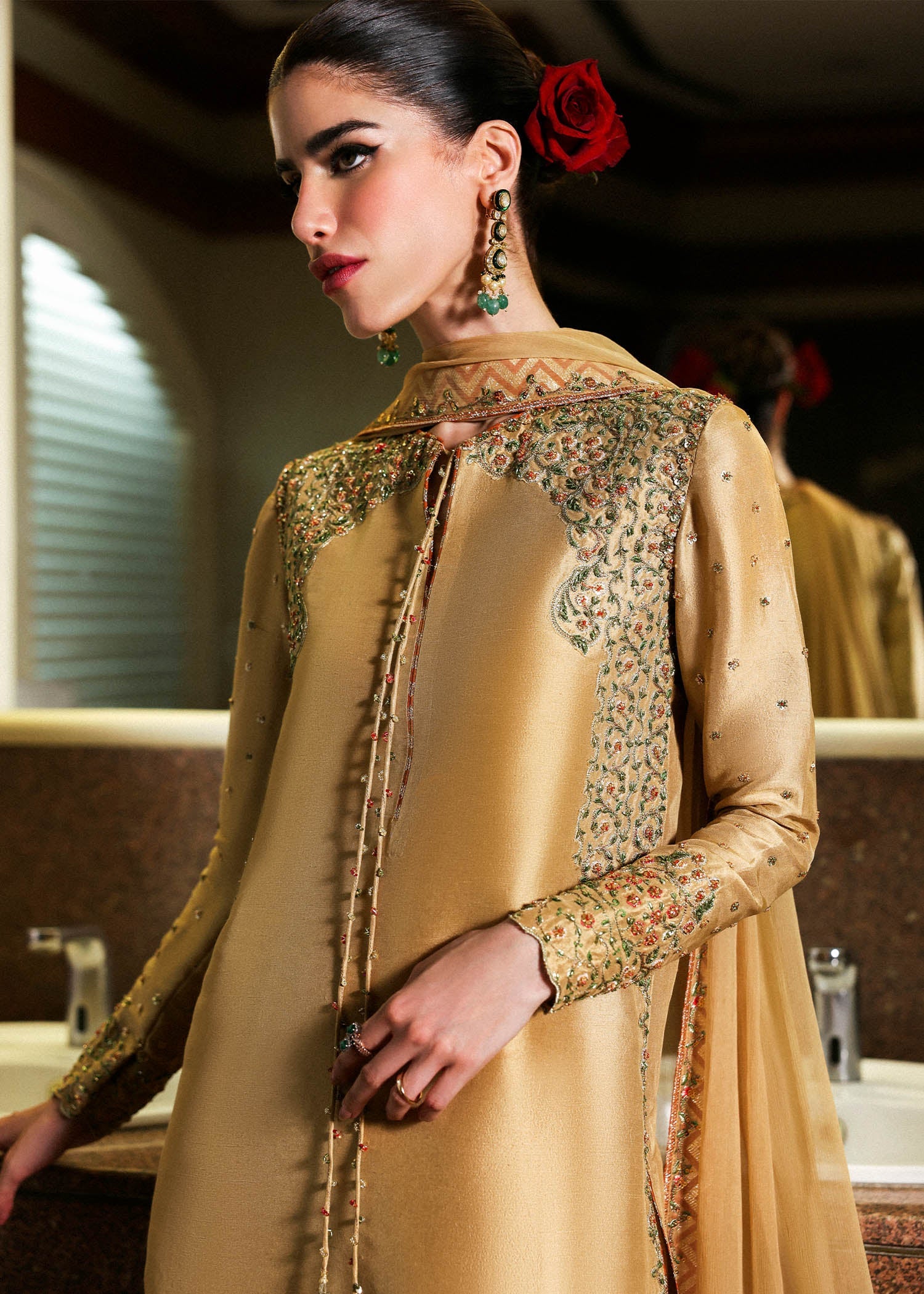 Model wearing gold Delune dress by Hussain Rehar, Pakistani luxury pret available online in UK for festive and wedding wear