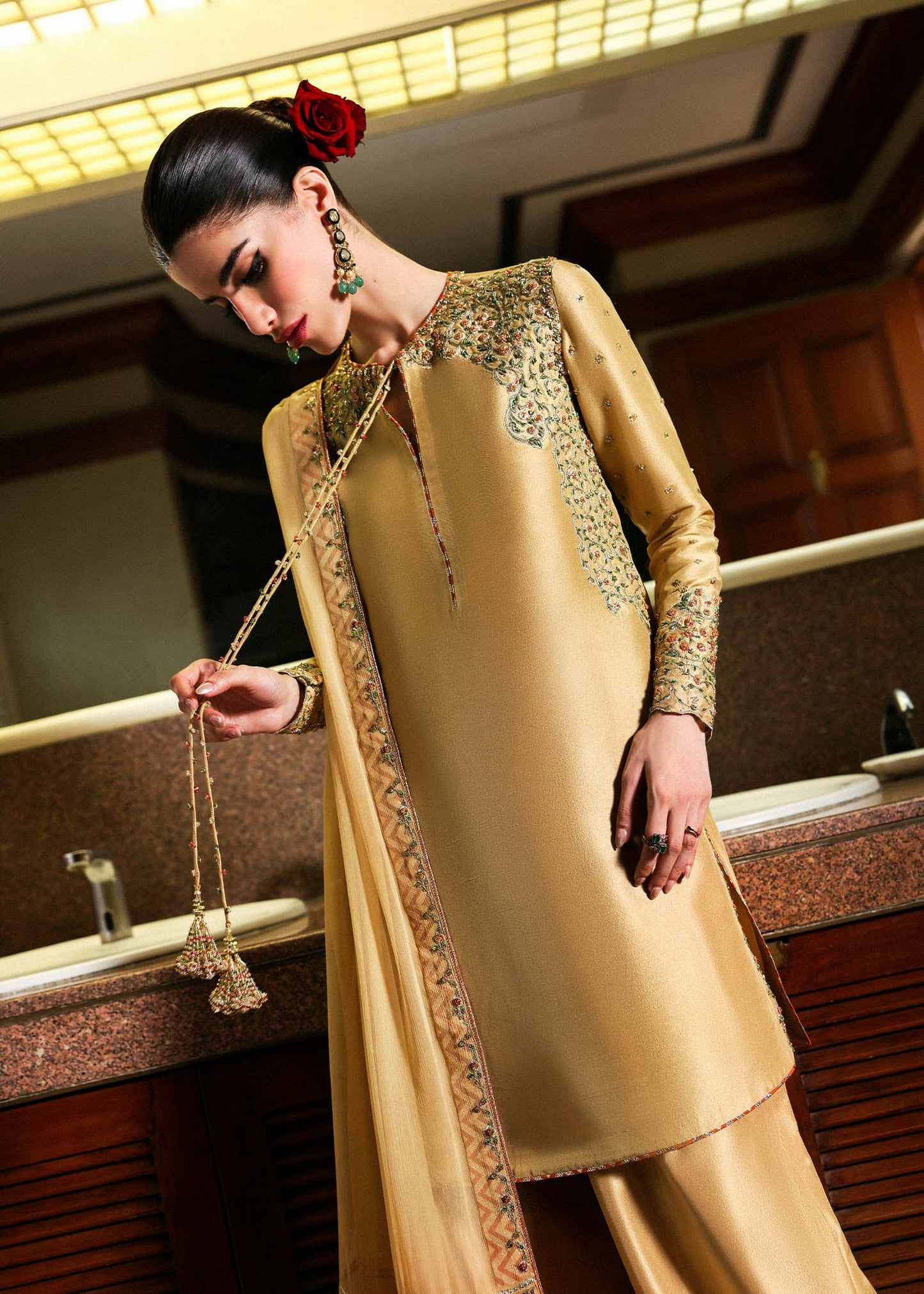 Model wearing gold Delune dress by Hussain Rehar, Pakistani luxury pret available online in UK for festive and wedding wear