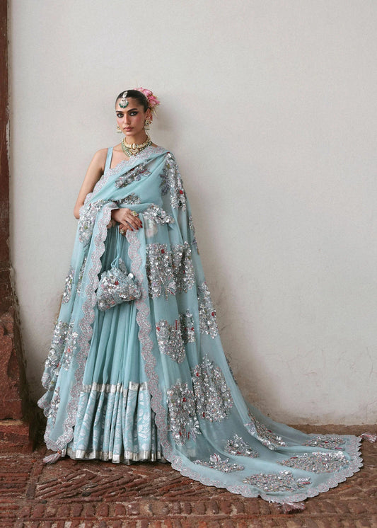 Model wearing Lilia by Hussain Rehar in powder blue with silver embellishments – stunning Pakistani luxury pret outfit in UK.