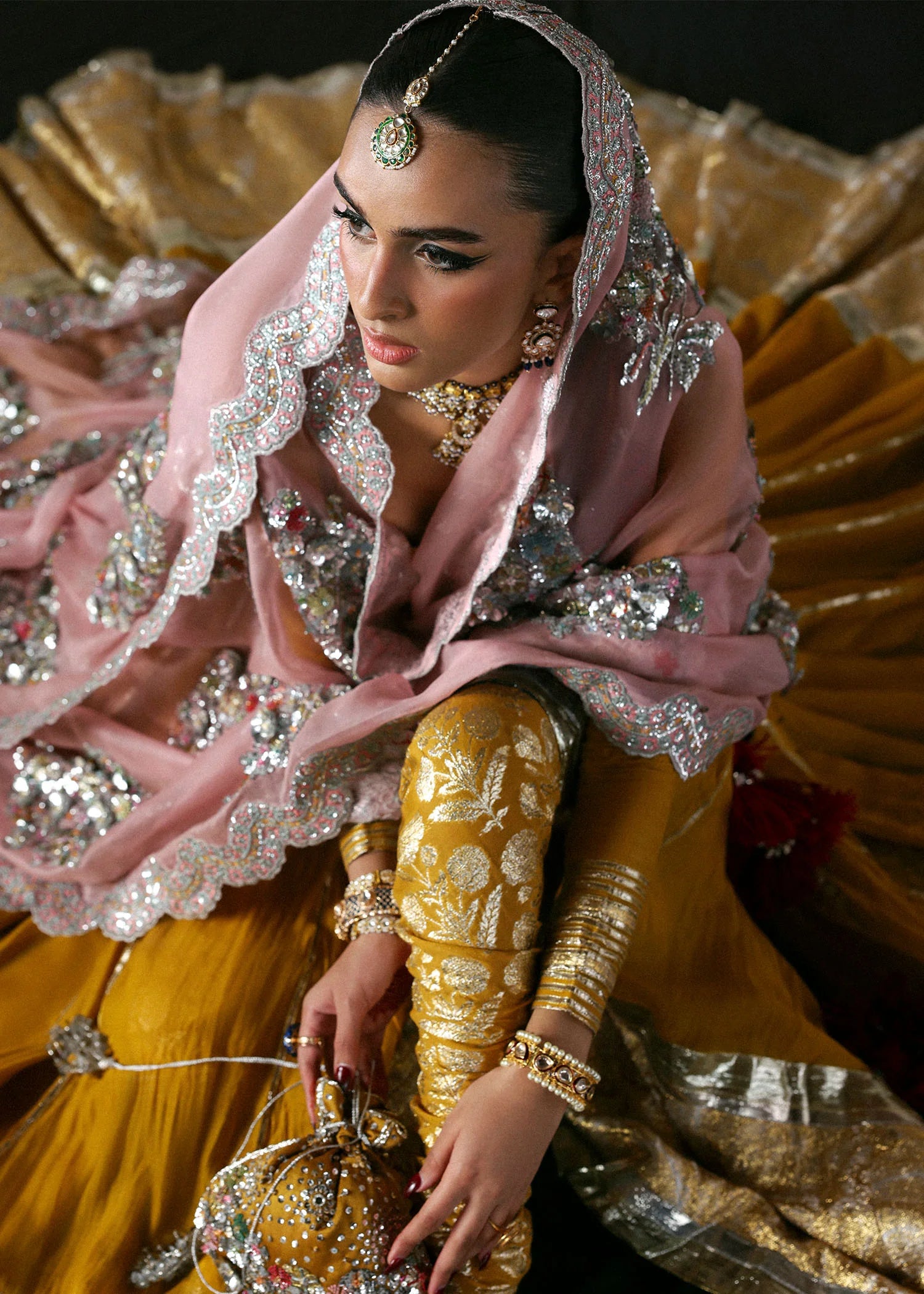 Model wearing Elika by Hussain Rehar in mustard and pink with heavy silver embellishments – exquisite Pakistani luxury pret outfit in UK.