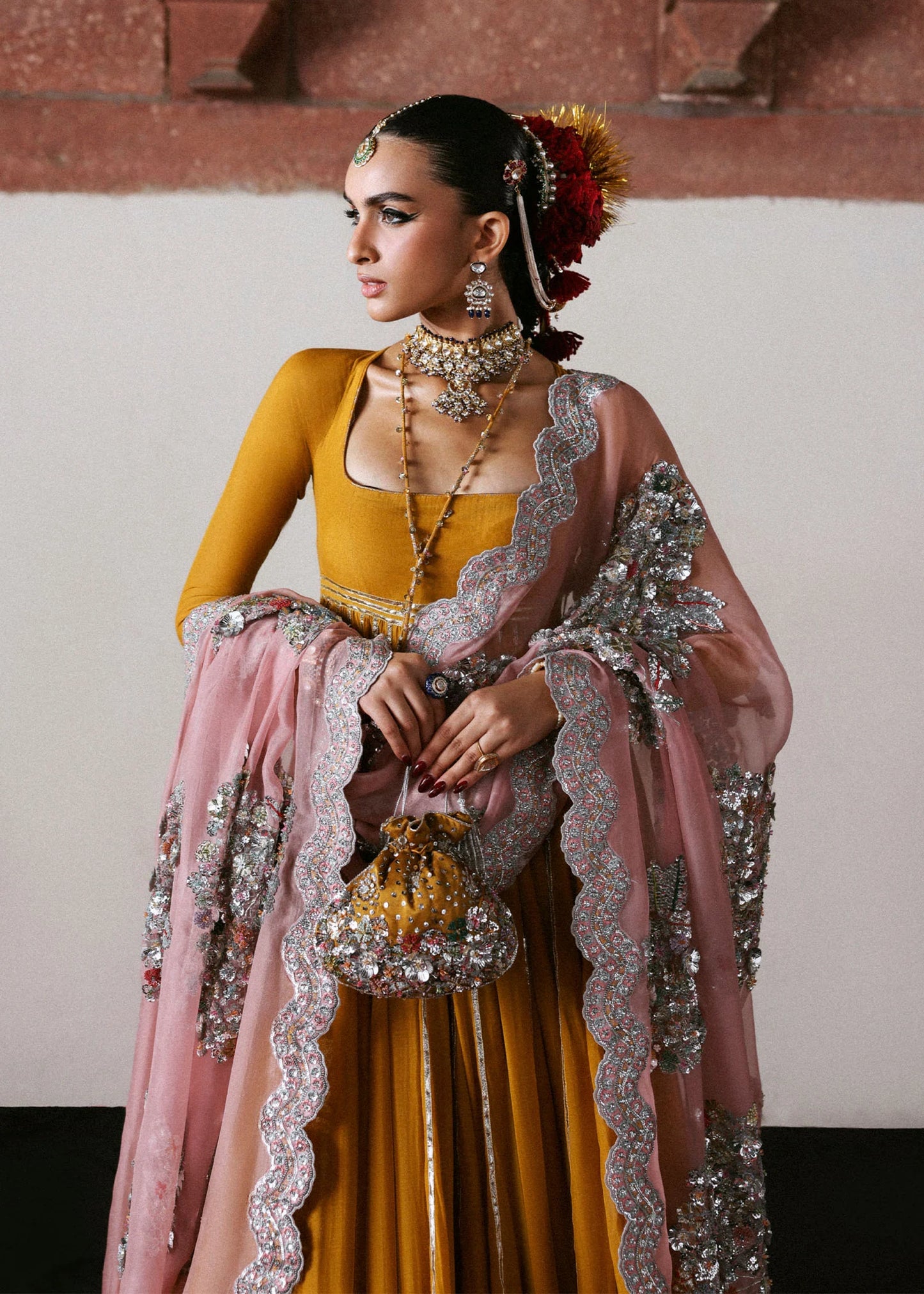 Model wearing Elika by Hussain Rehar in mustard and pink with heavy silver embellishments – exquisite Pakistani luxury pret outfit in UK.