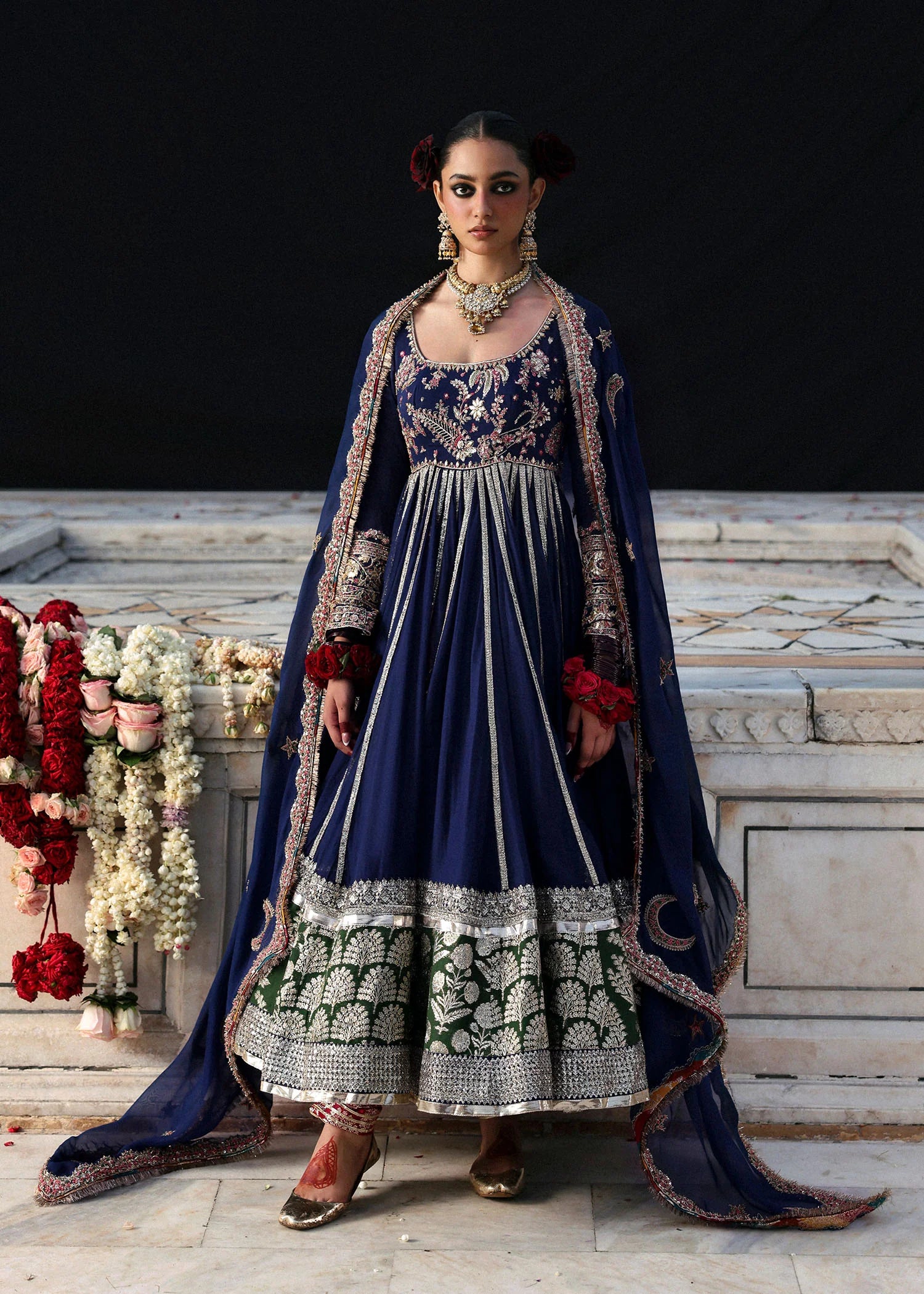 Model wearing Zarmina by Hussain Rehar in navy blue with intricate embroidery and green accents – elegant Pakistani luxury pret outfit in UK.