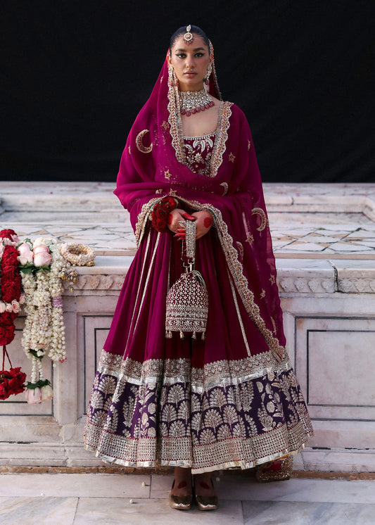 Model wearing Atash by Hussain Rehar in magenta with gold and silver embroidery – luxurious Pakistani luxury pret outfit in UK.