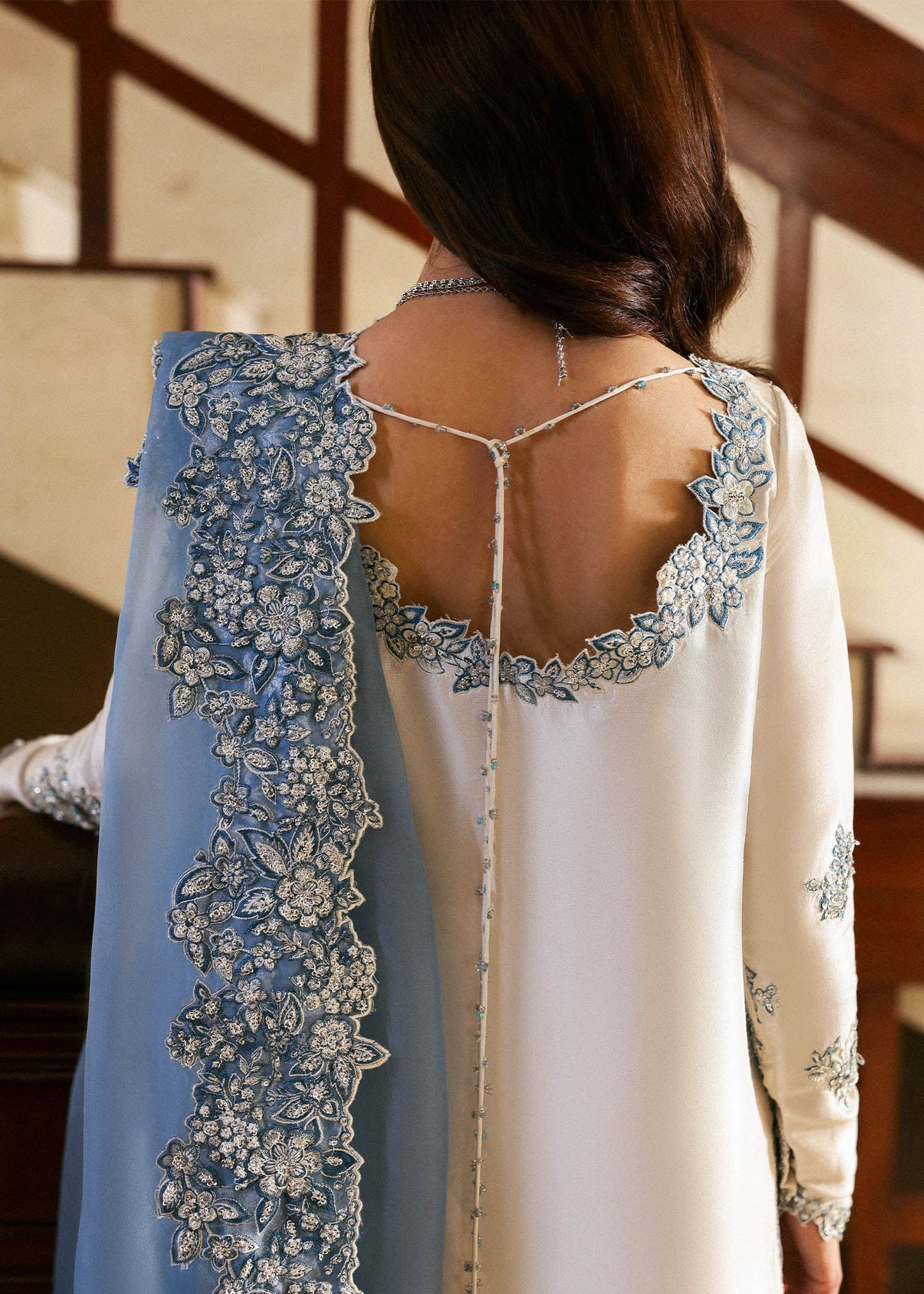 Model wearing off-white and blue Virelle dress by Hussain Rehar, Pakistani luxury pret available online in UK for occasions