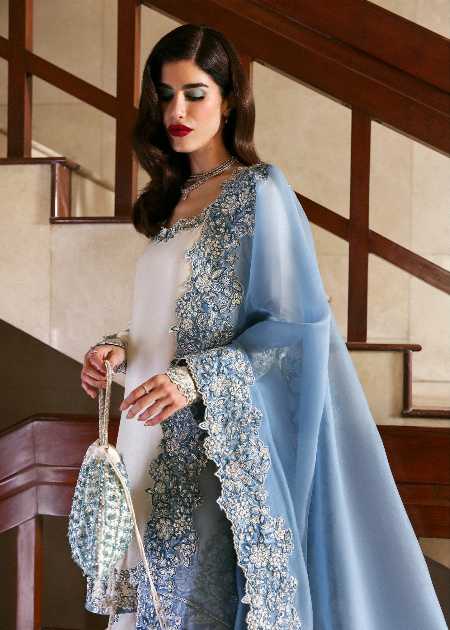 Model wearing off-white and blue Virelle dress by Hussain Rehar, Pakistani luxury pret available online in UK for occasions