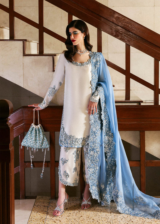 Model wearing off-white and blue Virelle dress by Hussain Rehar, Pakistani luxury pret available online in UK for occasions
