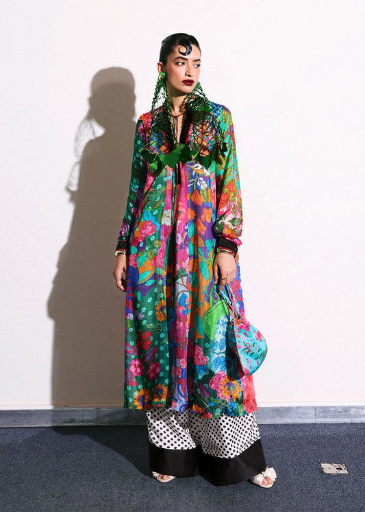 Model wearing multicolor floral Claret outfit with polka dot trousers from Hussain Rehar, ideal for Pakistani luxury pret in UK.