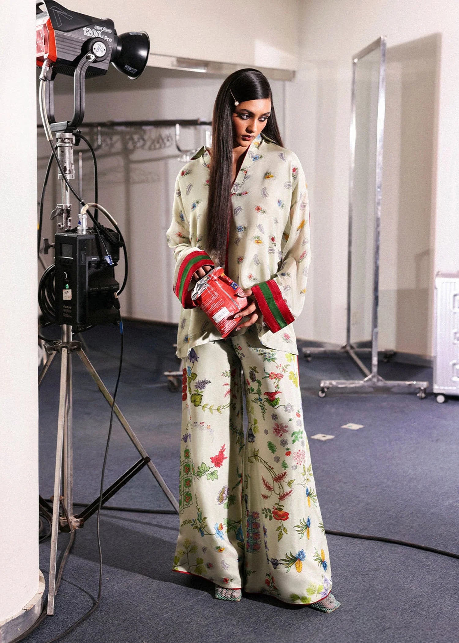 Model wearing ivory floral Mosselle outfit from Hussain Rehar featuring red and green cuff accents, ideal Pakistani luxury pret in UK.