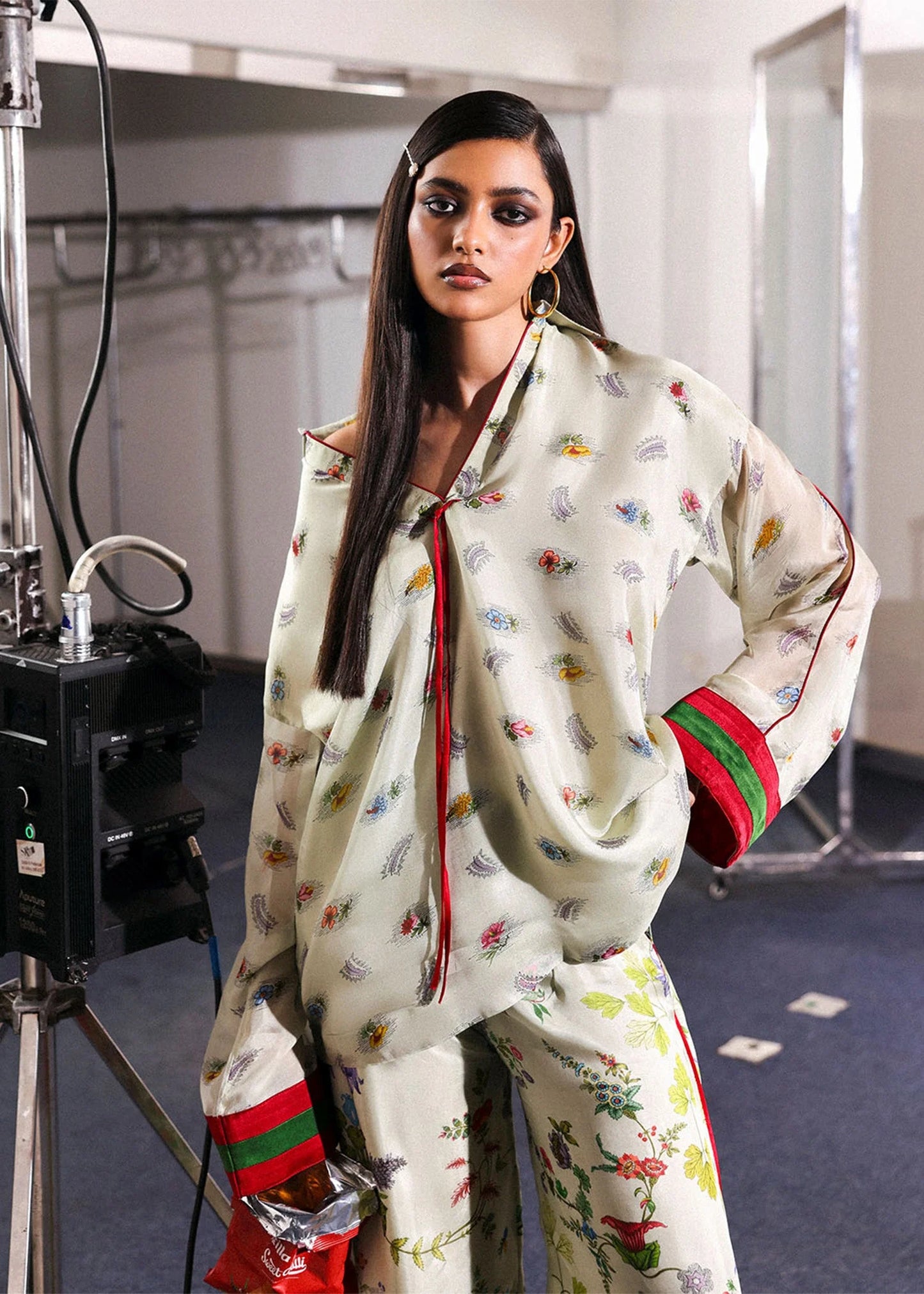 Model wearing ivory floral Mosselle outfit from Hussain Rehar featuring red and green cuff accents, ideal Pakistani luxury pret in UK.