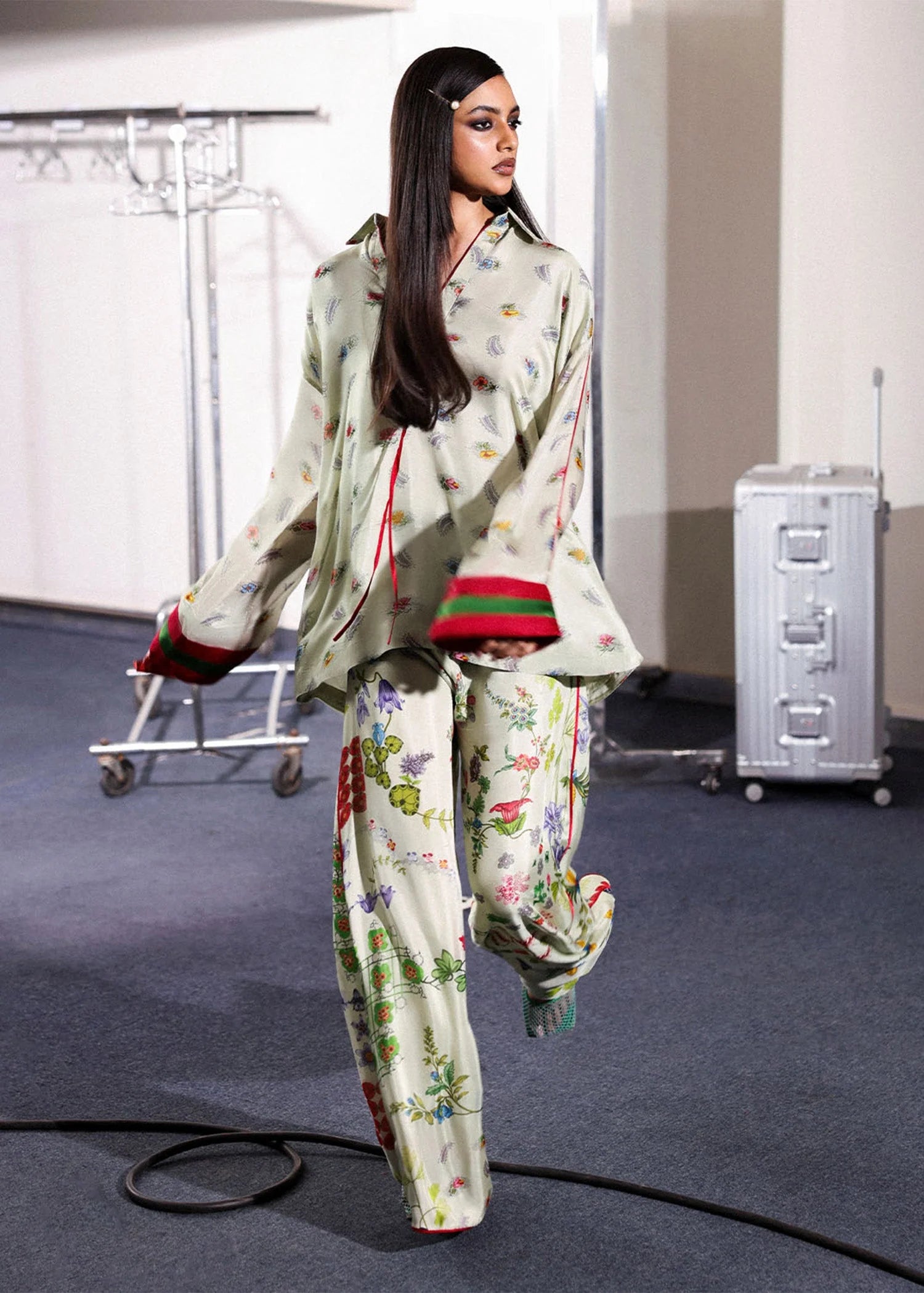 Model wearing ivory floral Mosselle outfit from Hussain Rehar featuring red and green cuff accents, ideal Pakistani luxury pret in UK.