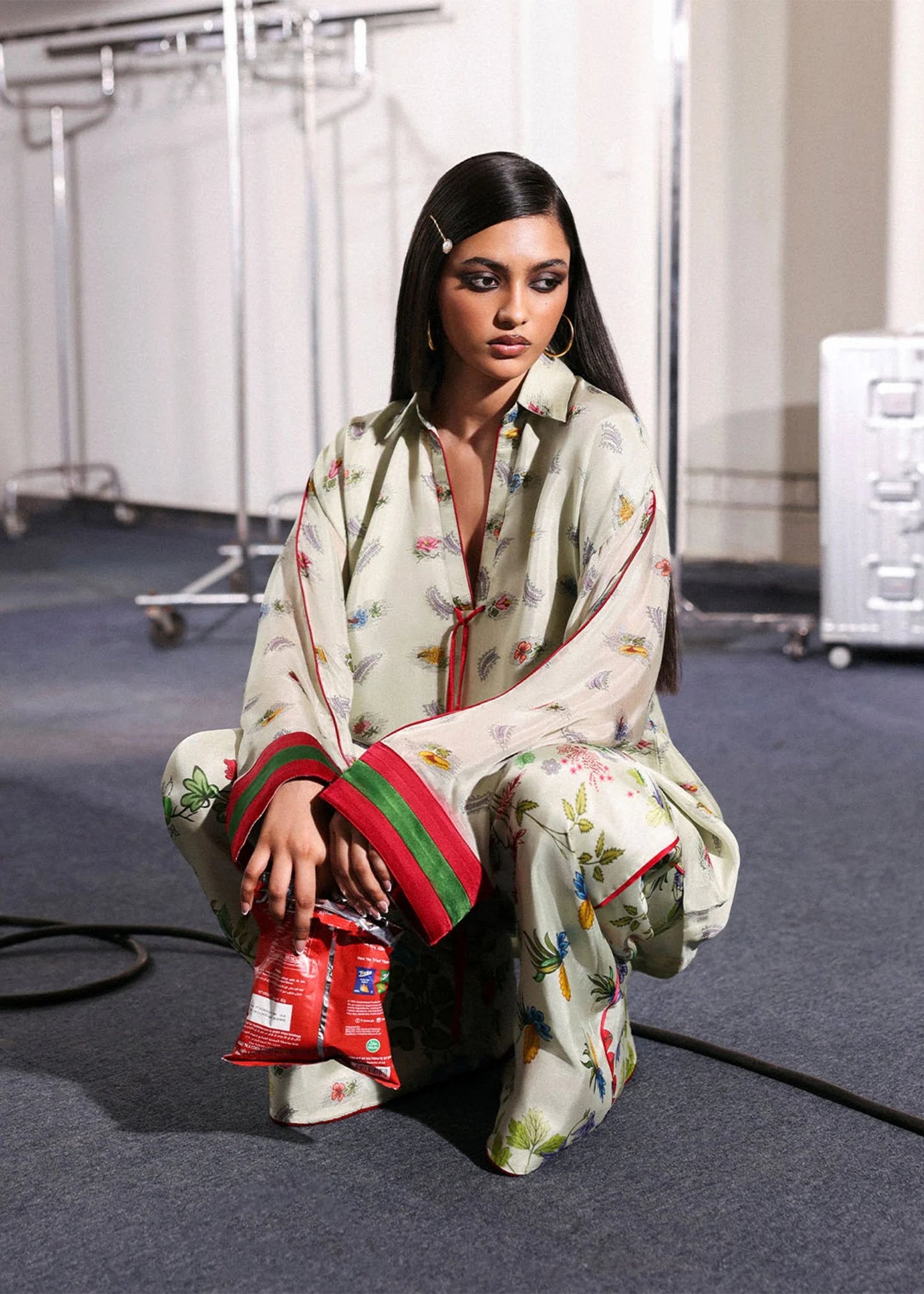 Model wearing ivory floral Mosselle outfit from Hussain Rehar featuring red and green cuff accents, ideal Pakistani luxury pret in UK.