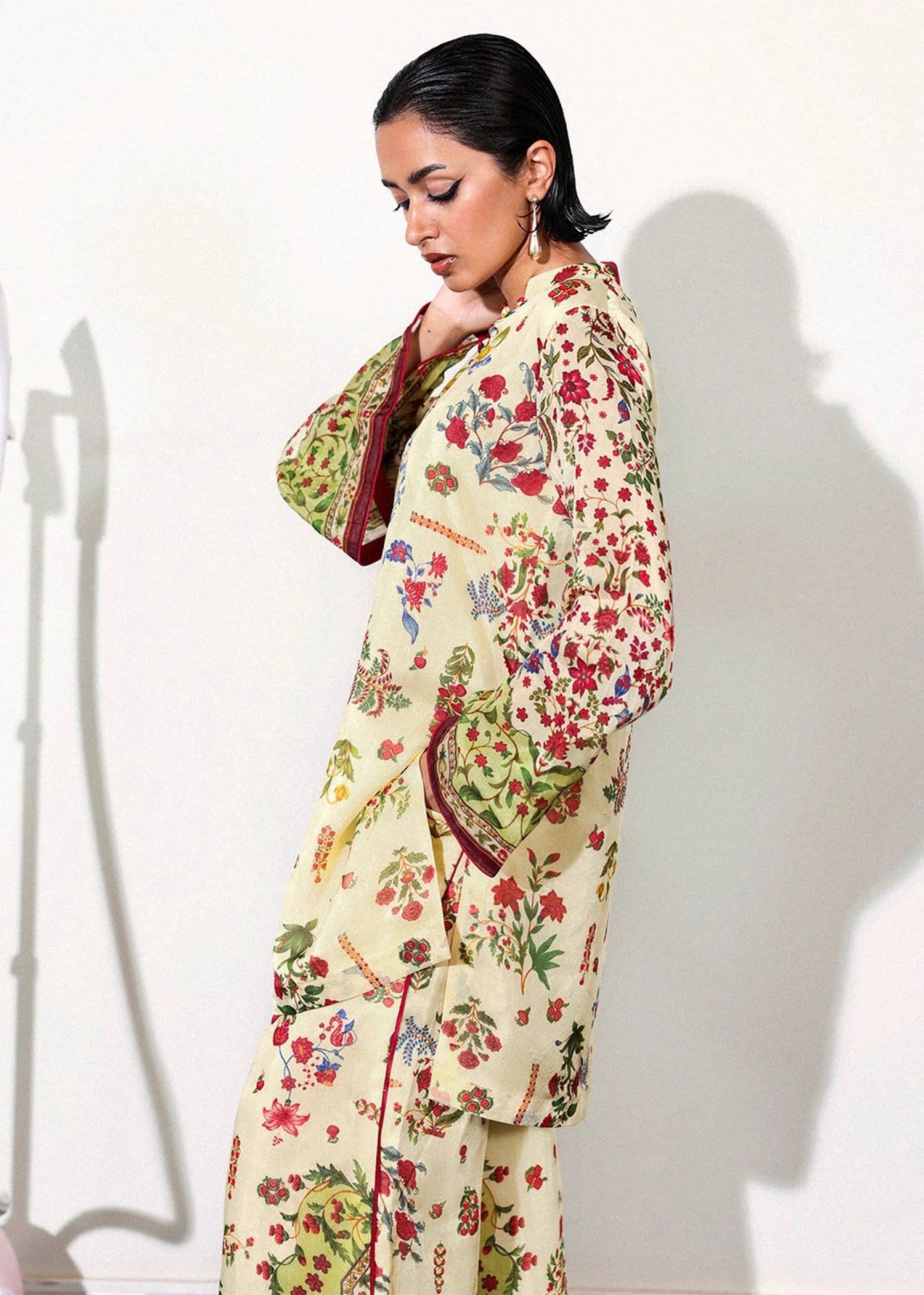Model wearing cream and multicolor floral Alouette outfit from Hussain Rehar, perfect for Pakistani luxury pret and clothes online in UK.