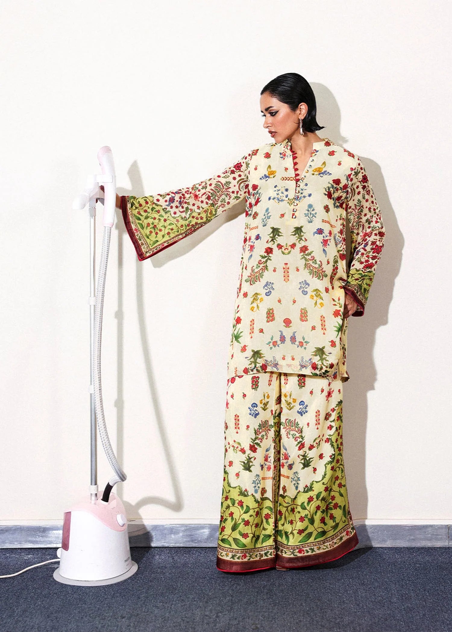 Model wearing cream and multicolor floral Alouette outfit from Hussain Rehar, perfect for Pakistani luxury pret and clothes online in UK.
