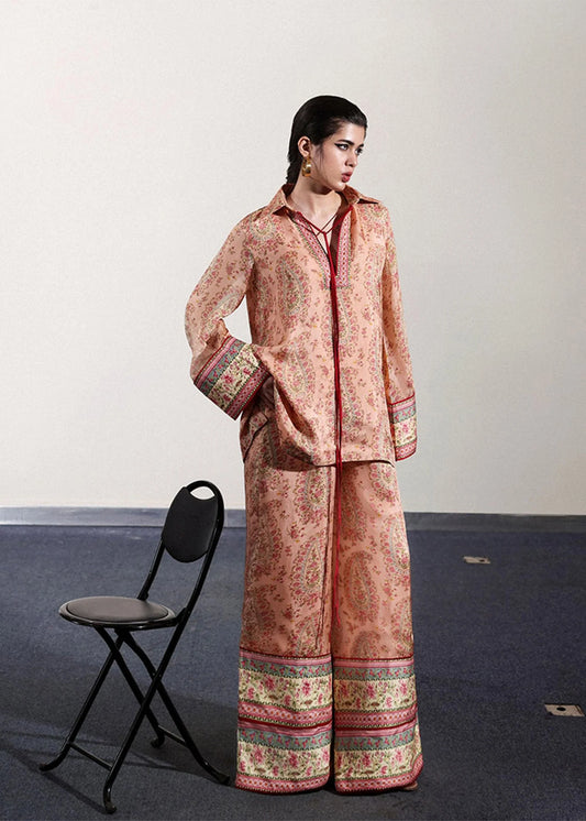 Model wearing peach and pink paisley printed outfit from Hussain Rehar, ideal for Pakistani luxury pret and clothes online in UK.