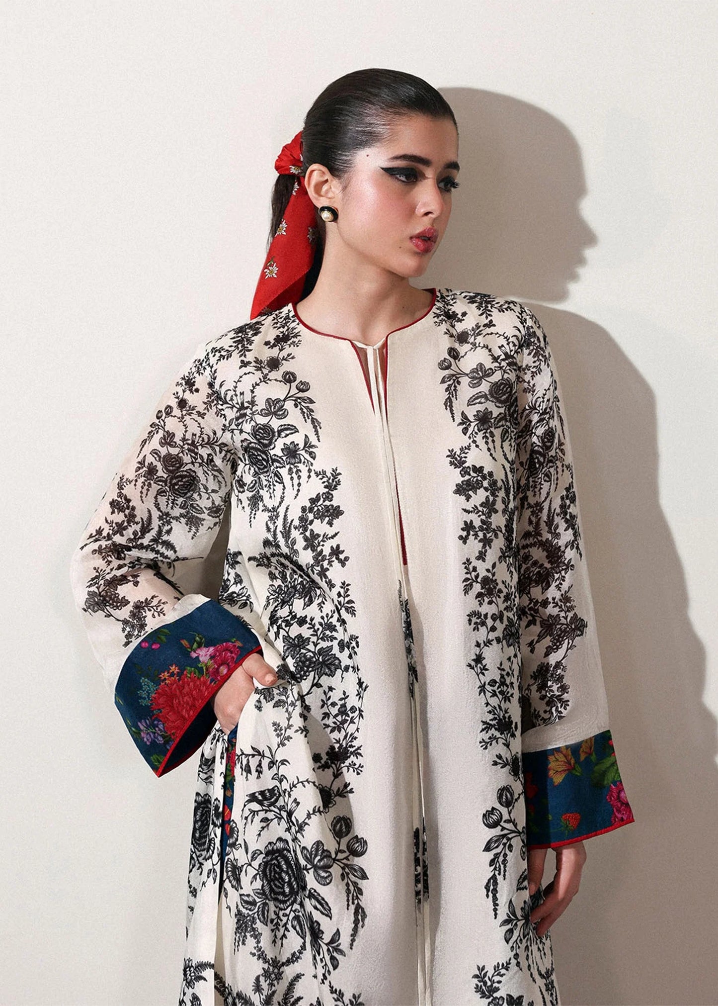 Model wearing off-white and black Ivraie outfit from Hussain Rehar, showcasing Pakistani luxury pret and Pakistani clothes online in UK.
