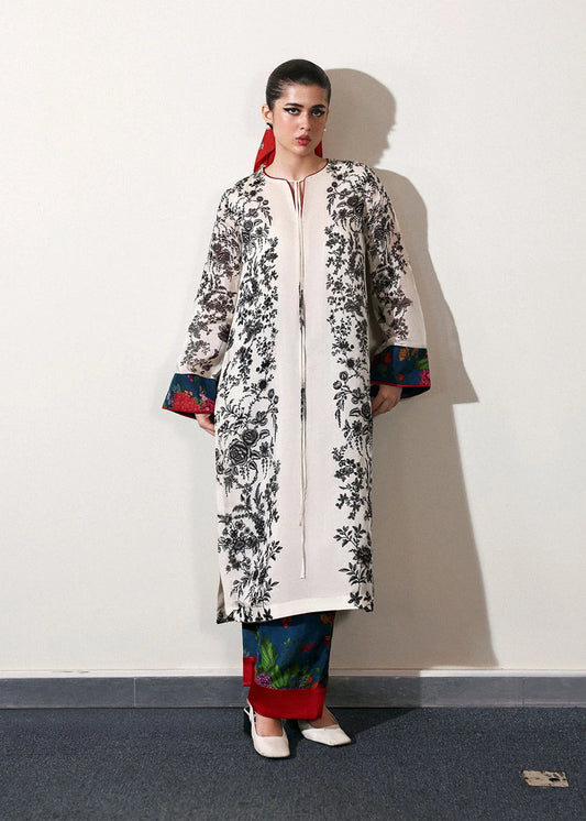 Model wearing off-white and black Ivraie outfit from Hussain Rehar, showcasing Pakistani luxury pret and Pakistani clothes online in UK.
