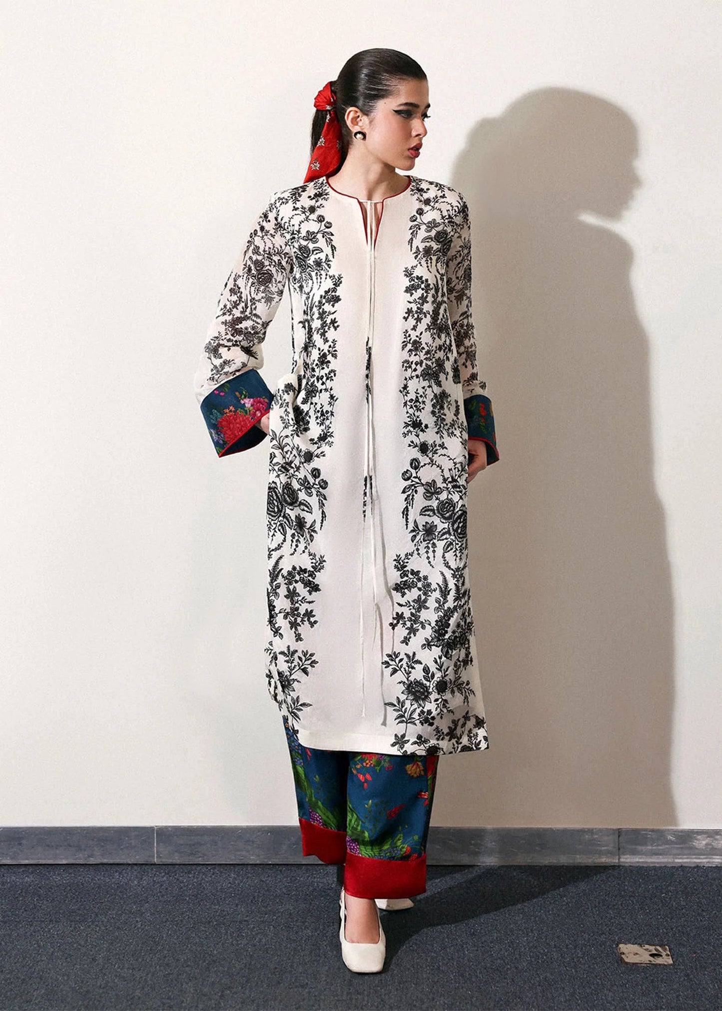 Model wearing off-white and black Ivraie outfit from Hussain Rehar, showcasing Pakistani luxury pret and Pakistani clothes online in UK.
