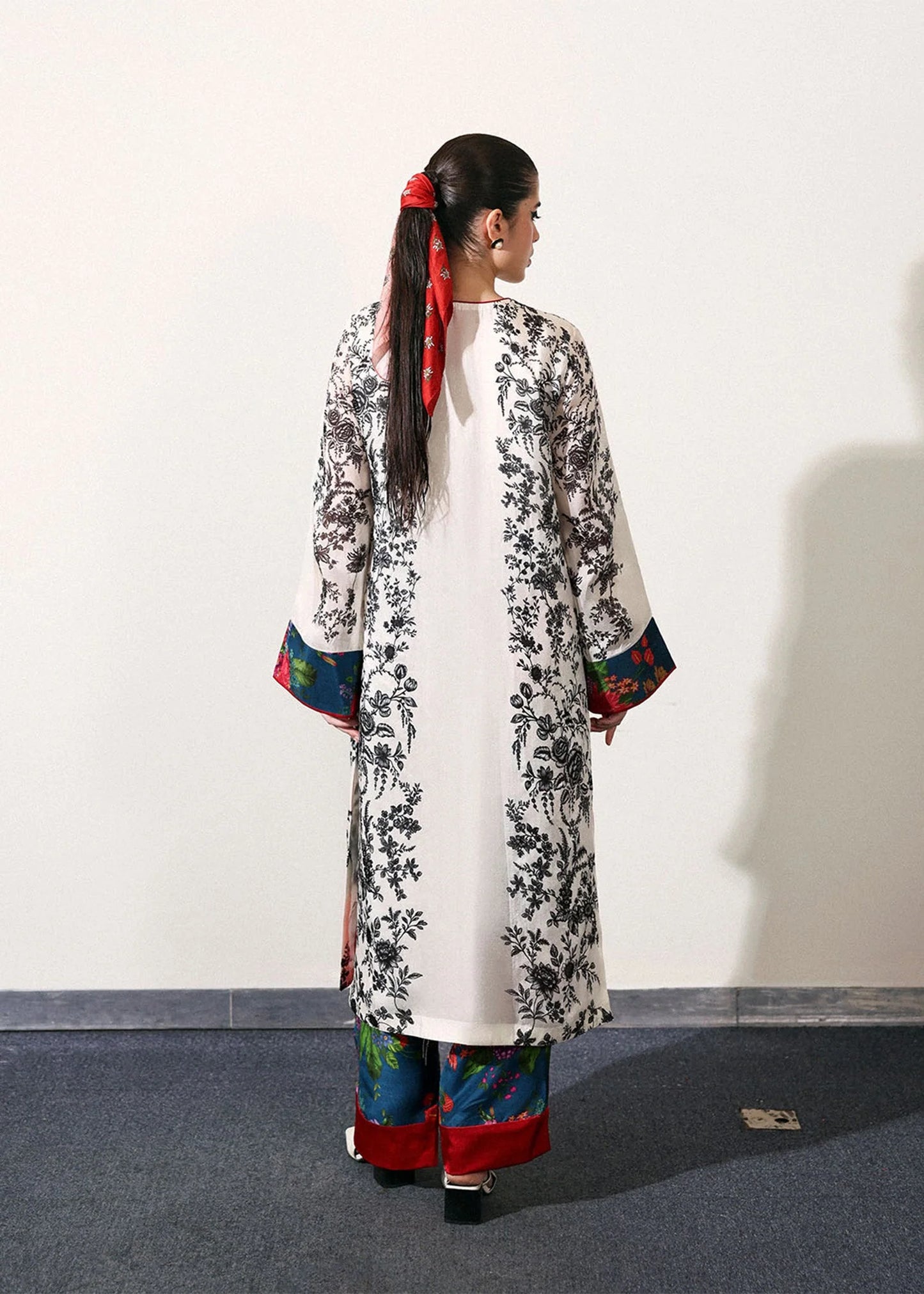 Model wearing off-white and black Ivraie outfit from Hussain Rehar, showcasing Pakistani luxury pret and Pakistani clothes online in UK.
