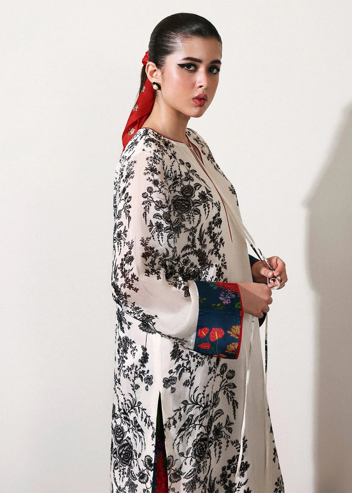 Model wearing off-white and black Ivraie outfit from Hussain Rehar, showcasing Pakistani luxury pret and Pakistani clothes online in UK.
