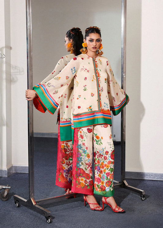 Model wearing cream multicolor Coraline outfit from Hussain Rehar with floral prints and green accents, perfect Pakistani luxury pret in UK.