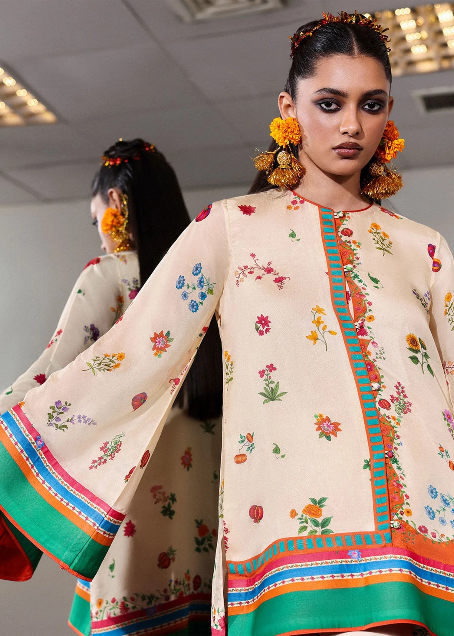 Model wearing cream multicolor Coraline outfit from Hussain Rehar with floral prints and green accents, perfect Pakistani luxury pret in UK.