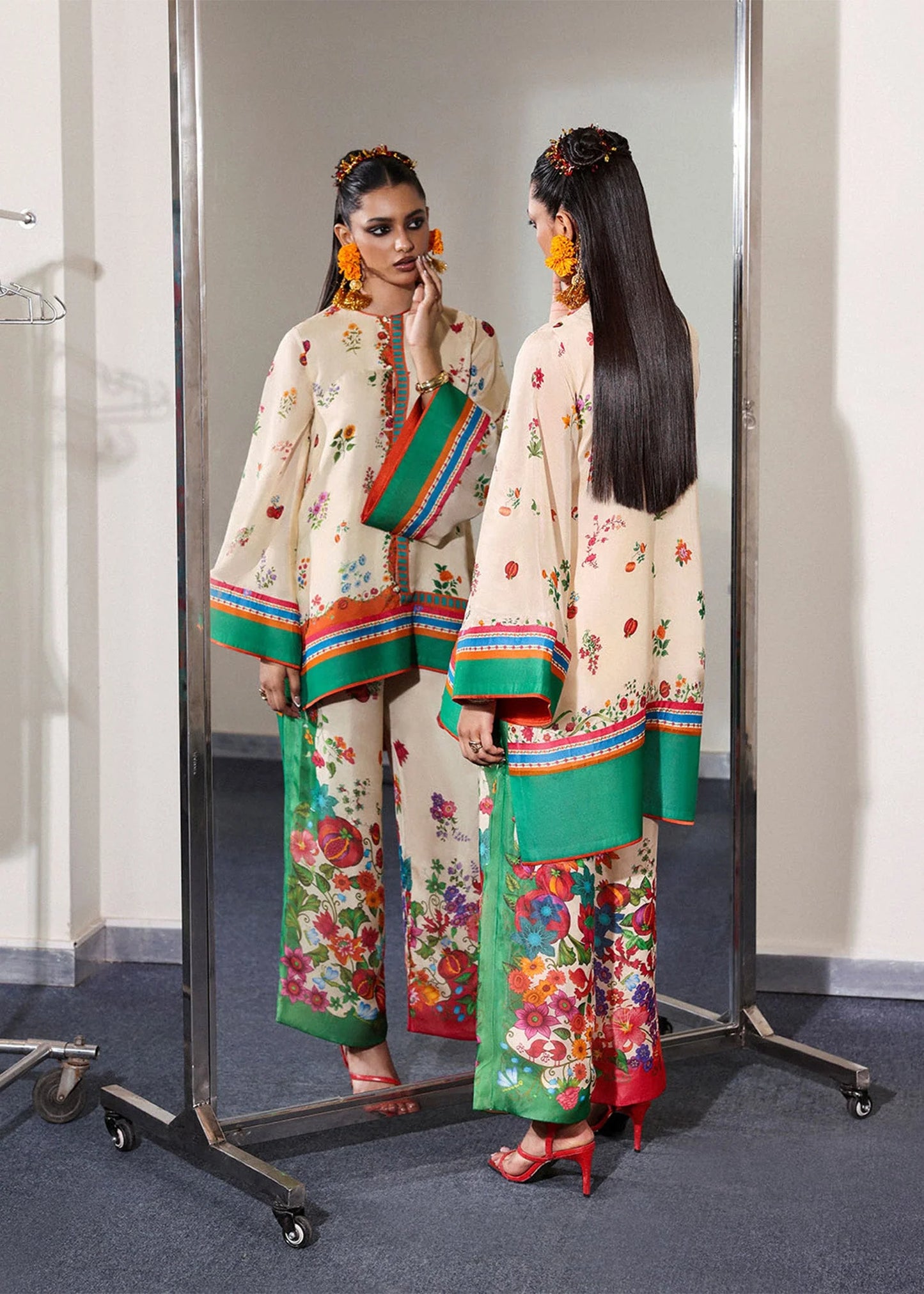 Model wearing cream multicolor Coraline outfit from Hussain Rehar with floral prints and green accents, perfect Pakistani luxury pret in UK.