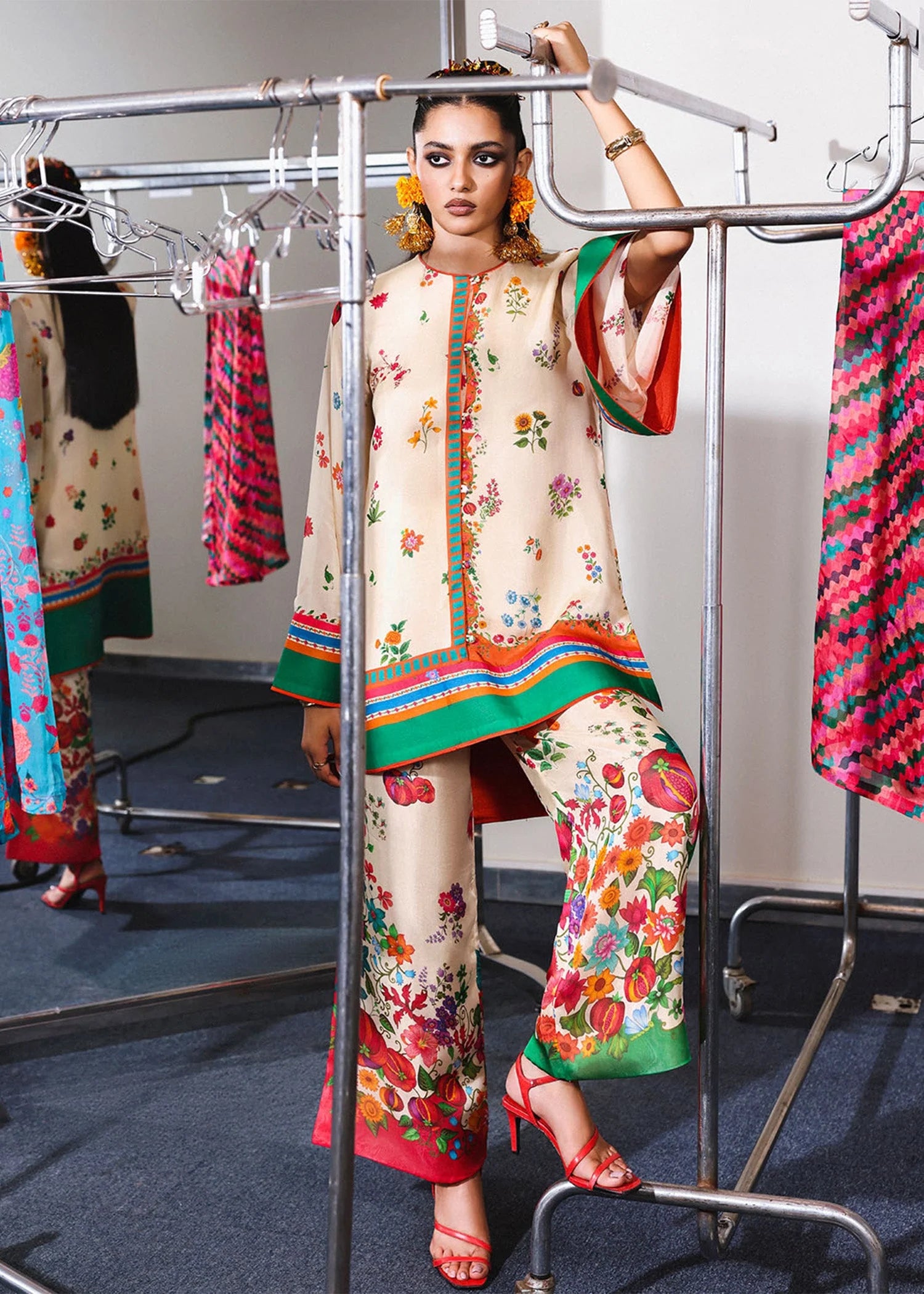 Model wearing cream multicolor Coraline outfit from Hussain Rehar with floral prints and green accents, perfect Pakistani luxury pret in UK.