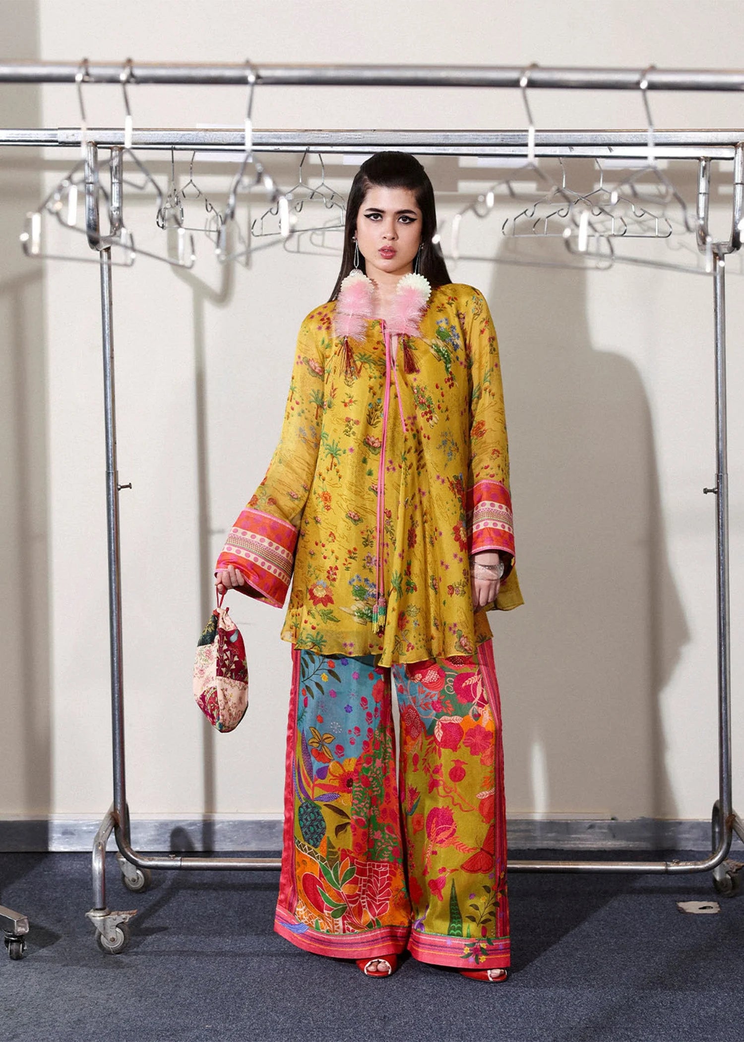 Model wearing mustard yellow and multicolor Aurora set from Hussain Rehar PAY DAY VOL - V, perfect Pakistani luxury pret in the UK.