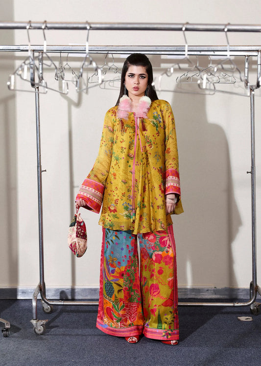 Model wearing mustard yellow and multicolor Aurora set from Hussain Rehar PAY DAY VOL - V, perfect Pakistani luxury pret in the UK.